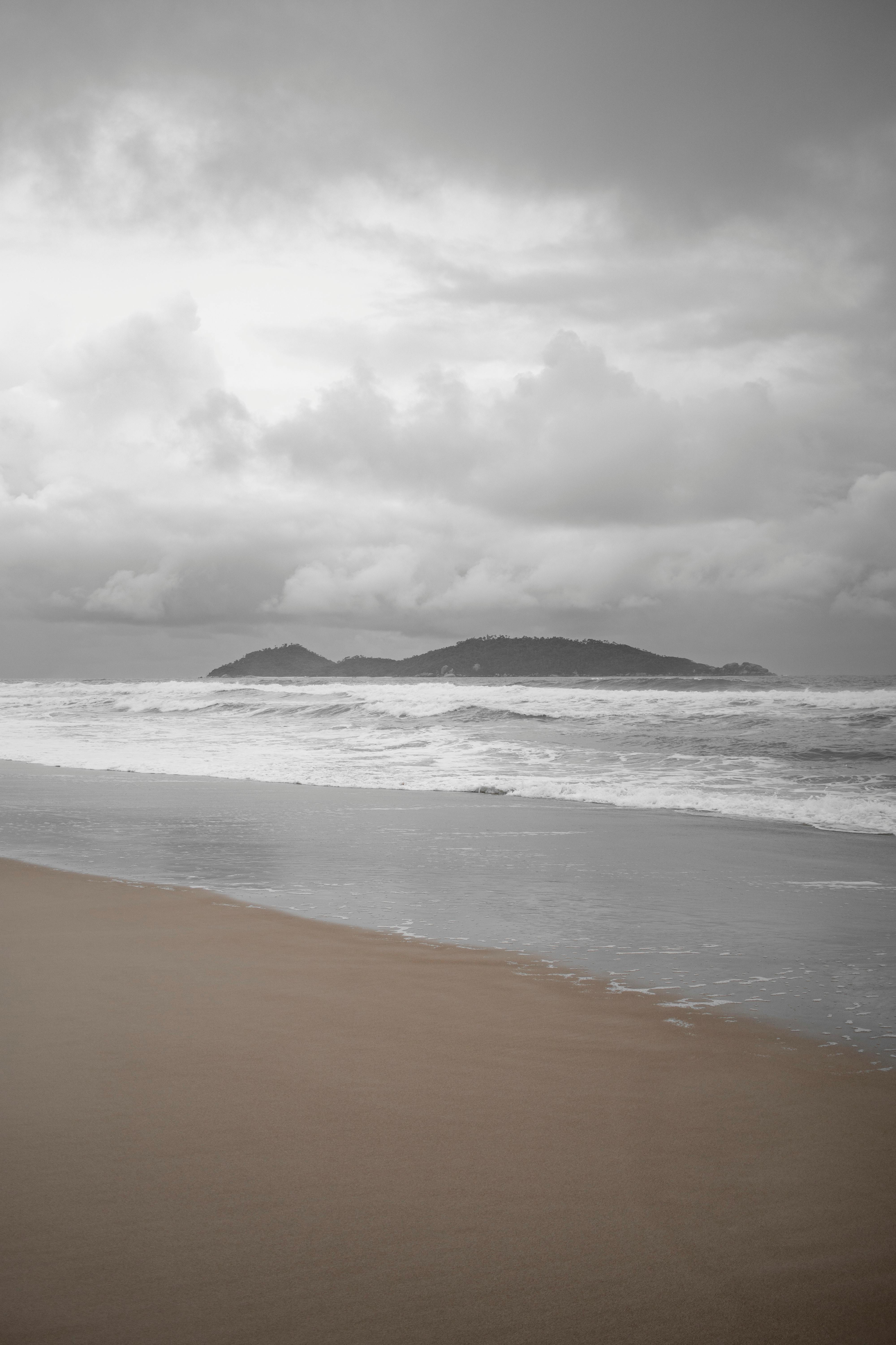 Dark Clouds Over a Beach by the Sea · Free