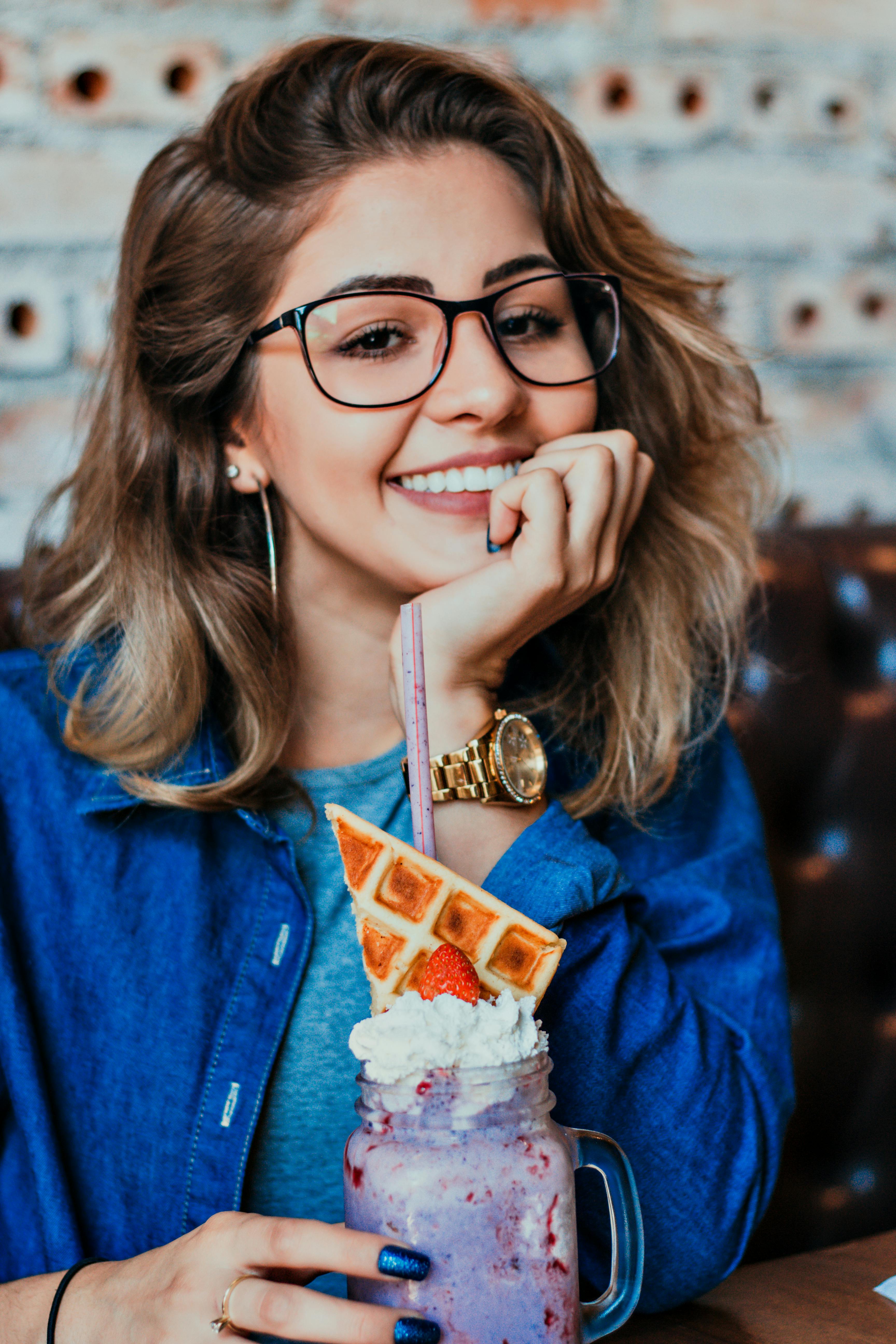 Woman in Eyeglasses With Black Frames Posing for Photo · Free