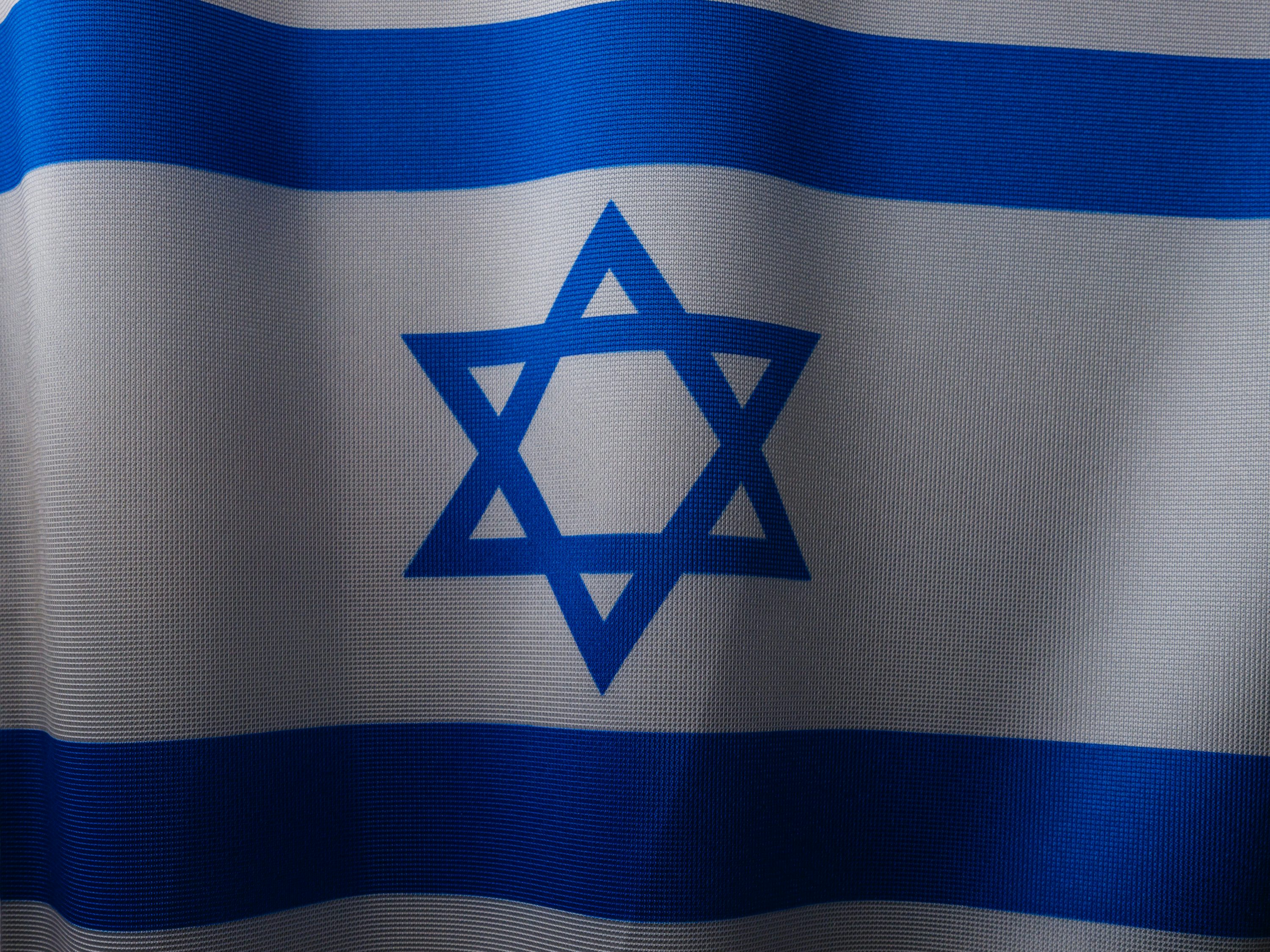A close up of a flag with a star of david on it photo