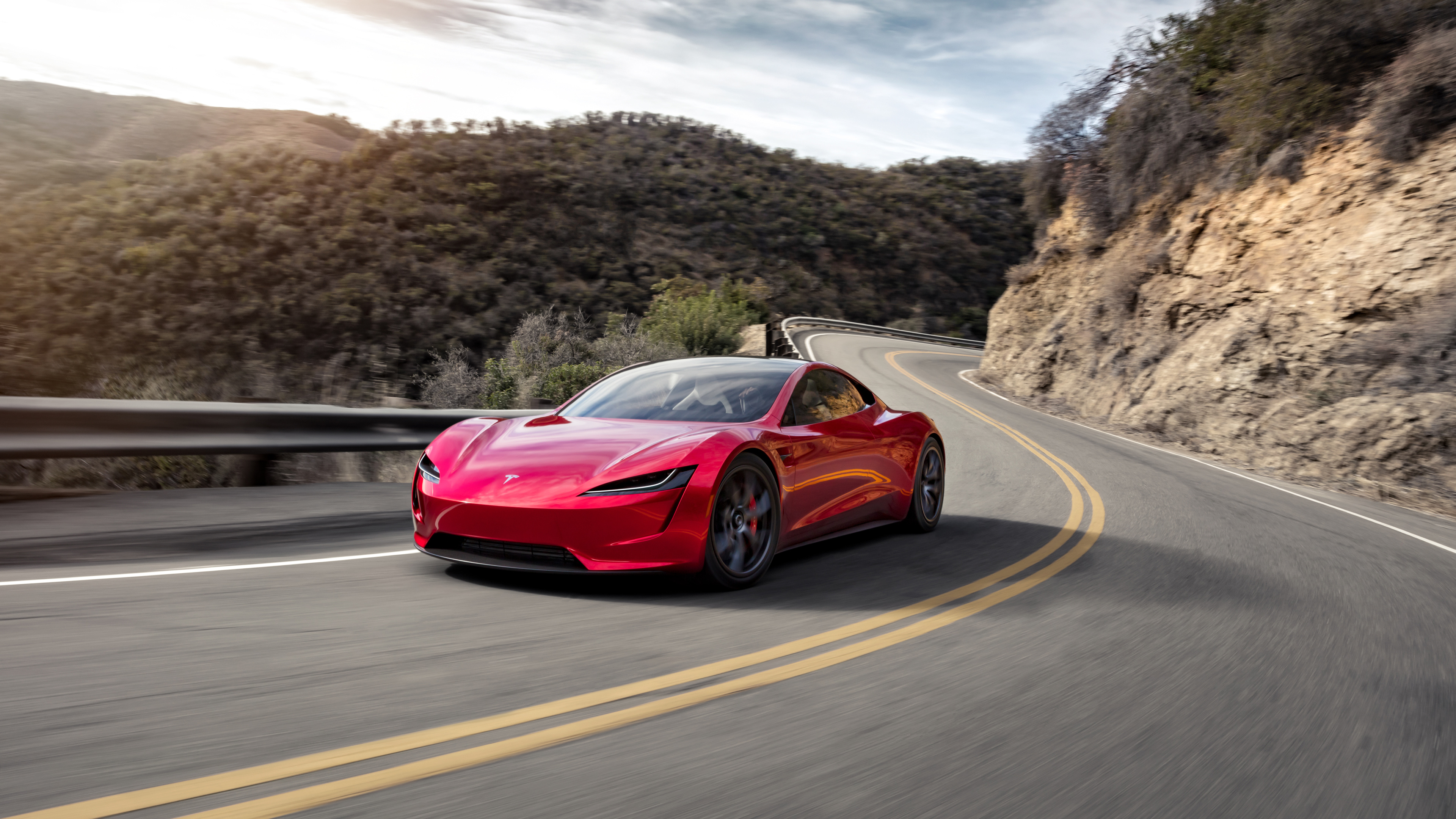 Red car Tesla Roadster on the road near the mountains Desktop wallpaper 1366x768