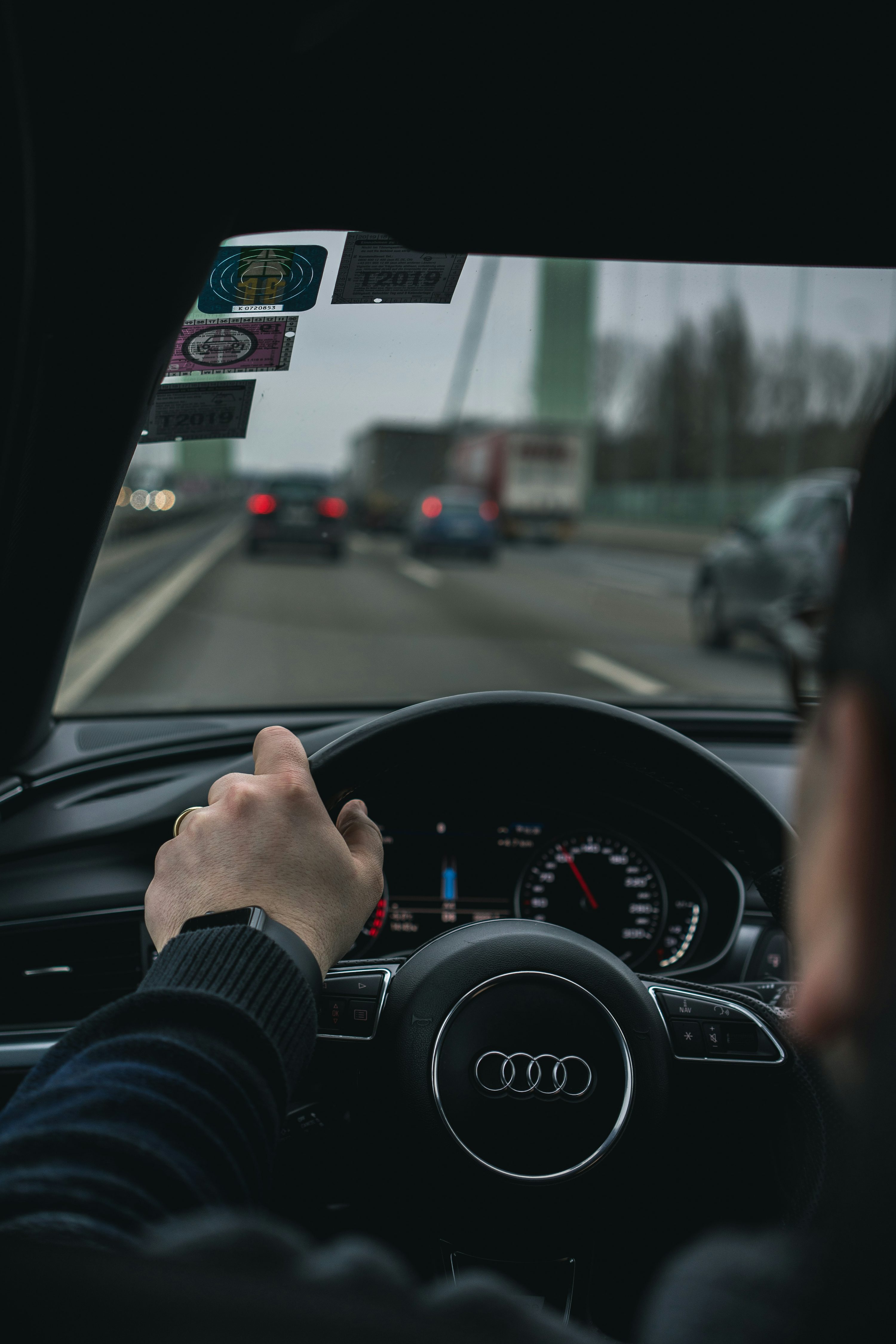 Person driving car on road during daytime photo
