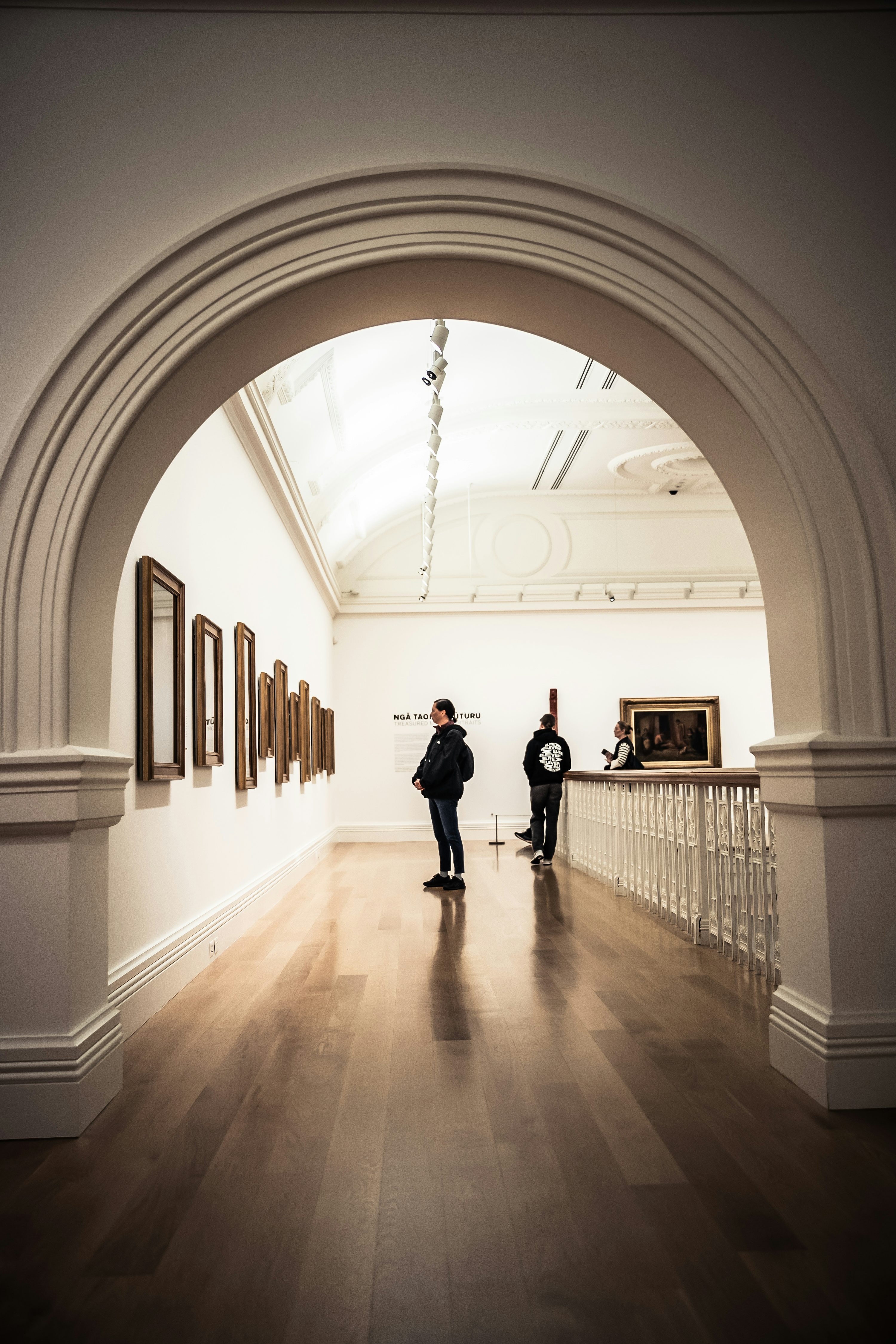 People viewing art in a museum gallery photo