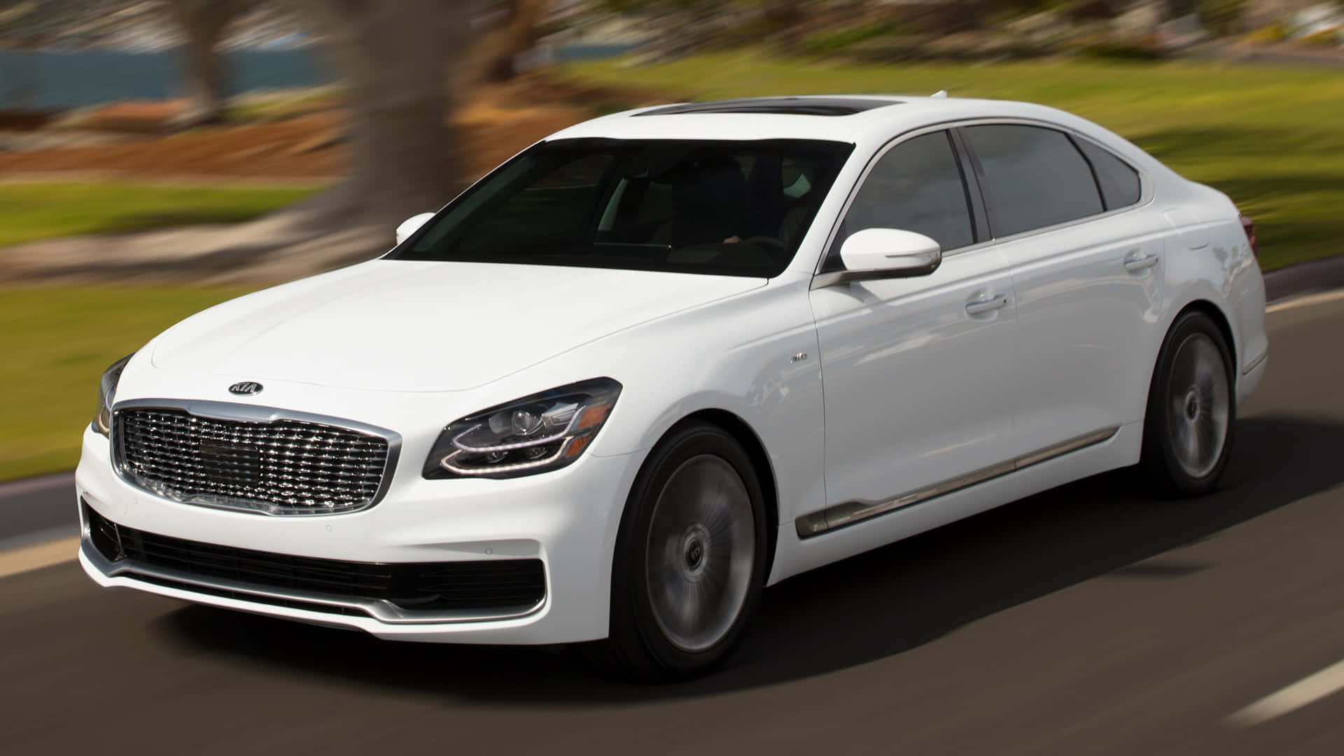 Download Luxurious And Elegant Kia K900 On The Night Road Wallpaper