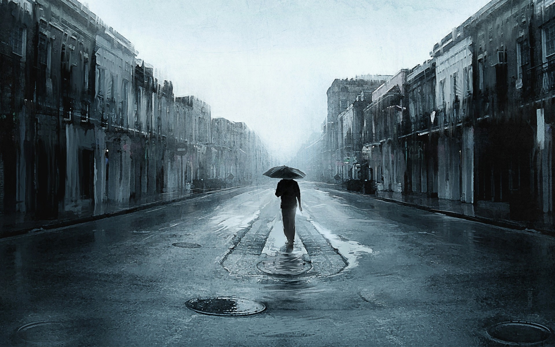 A man in the rain in a dark street