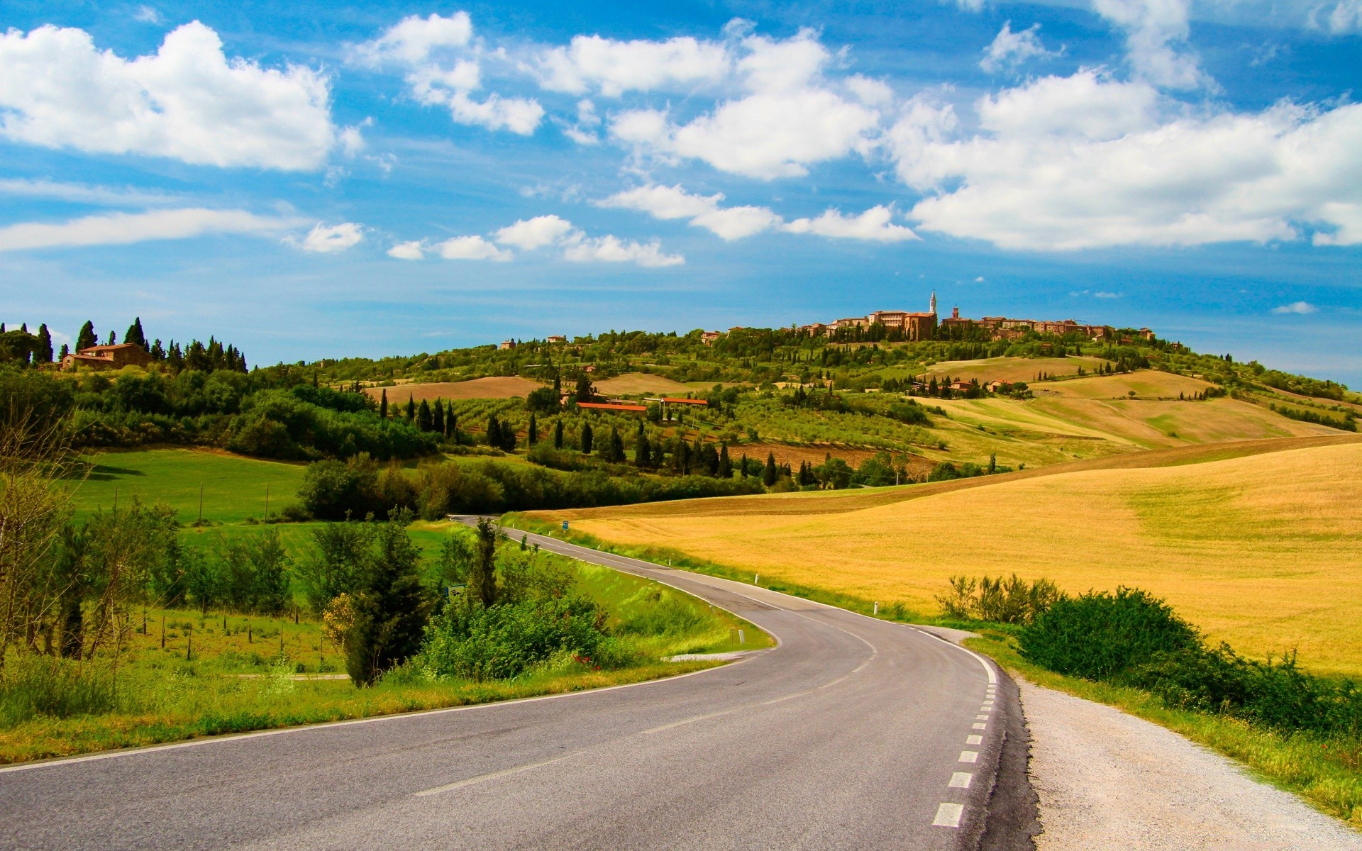 A road in the countryside among the golden hills