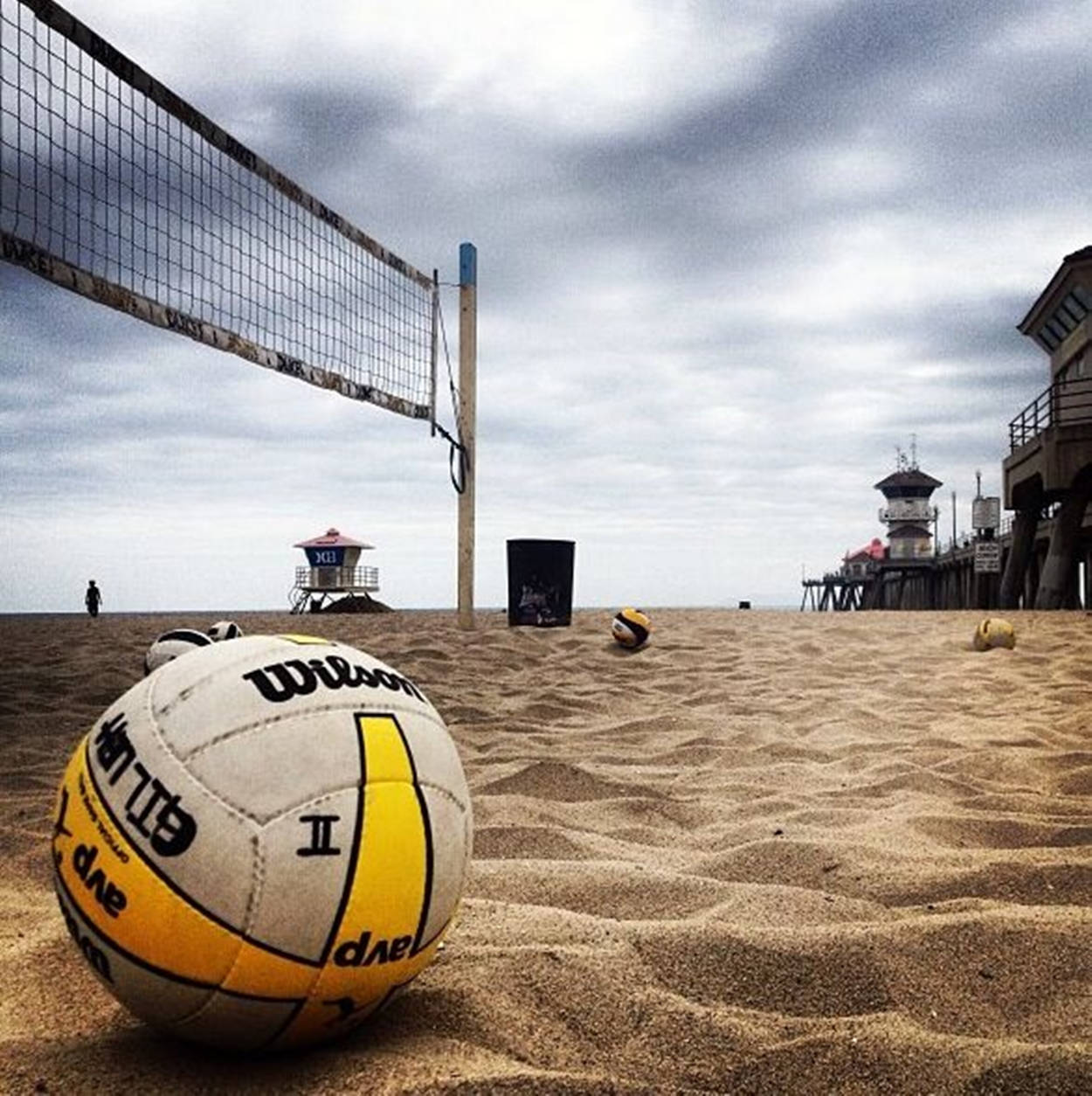 Download Wilson Beach Volleyball Under Gray Clouds Wallpaper