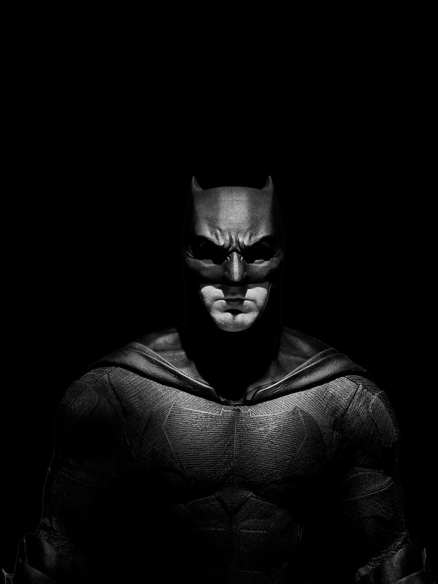 Download A striking Batman in black and white Wallpaper