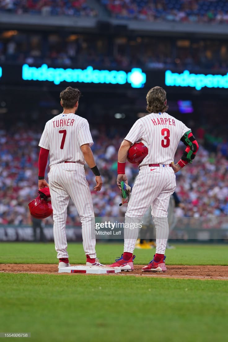 Trea Turner of the Philadelphia Phillies talks to Bryce Harper