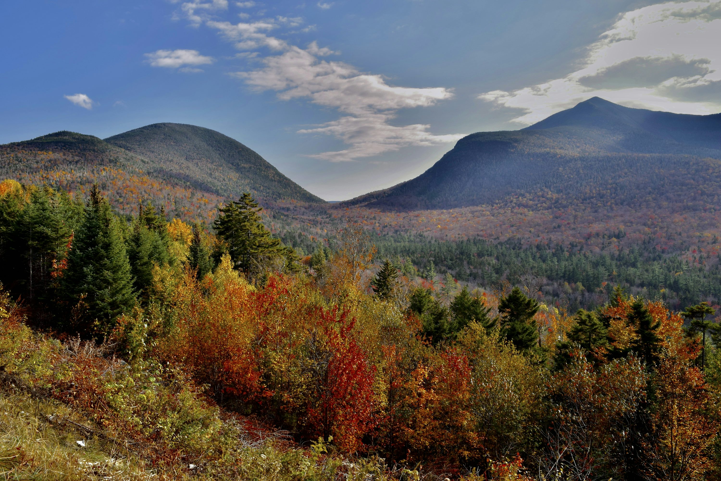 A scenic view of a mountain range in autumn photo