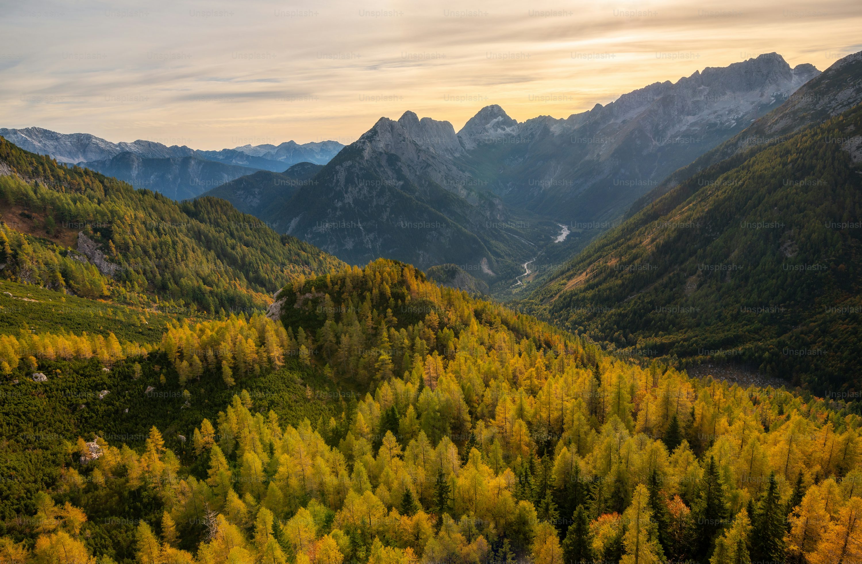 A scenic view of a valley with mountains in the background photo