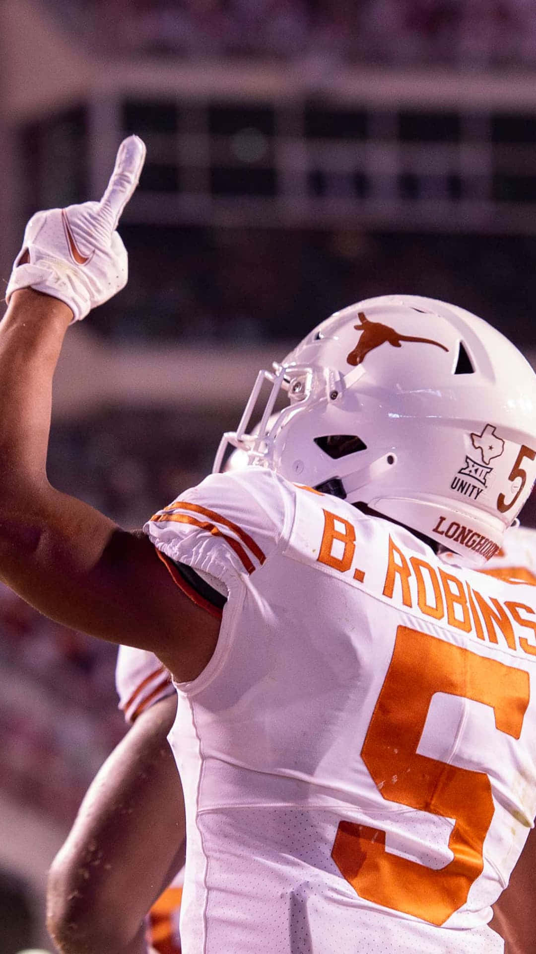 Download Bijan Robinson Texas Longhorns Celebration Wallpaper