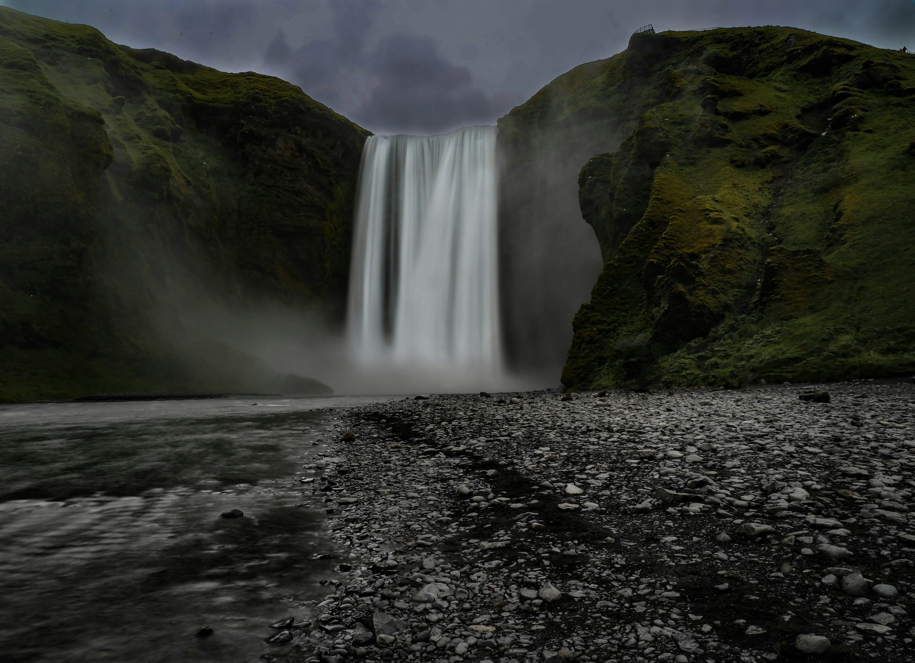 Skogafoss in Iceland under cloudy sky photo