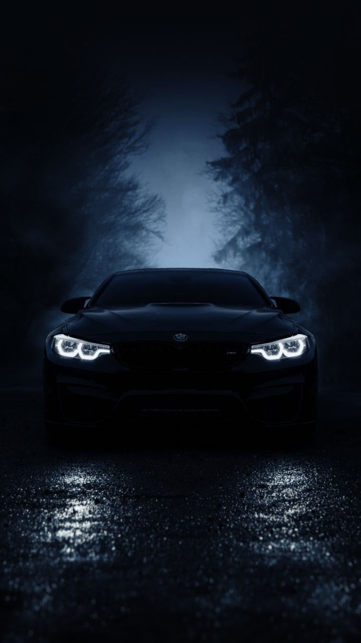 Black Sports Car on Wet Road