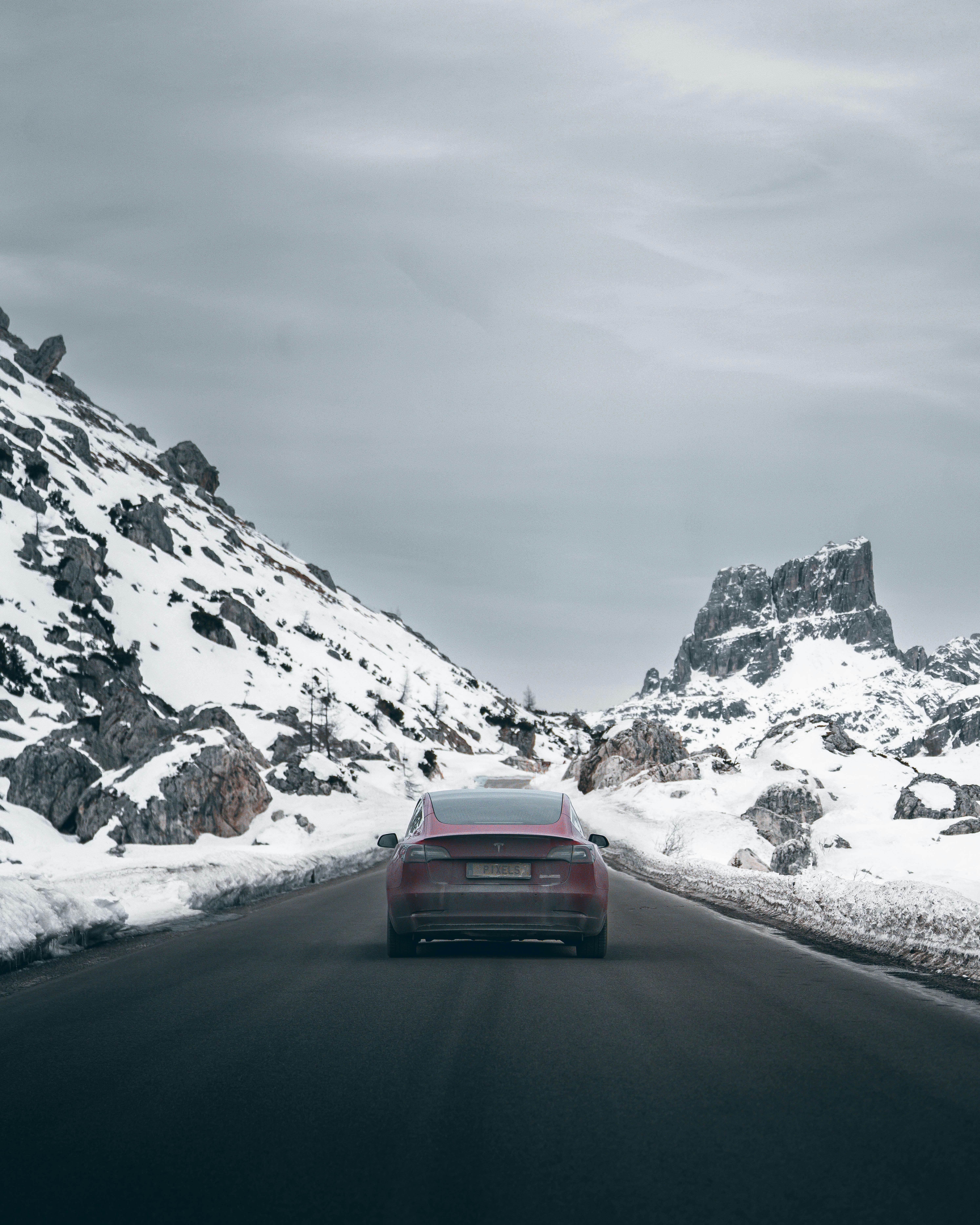 Tesla Car on Gray Asphalt Road · Free