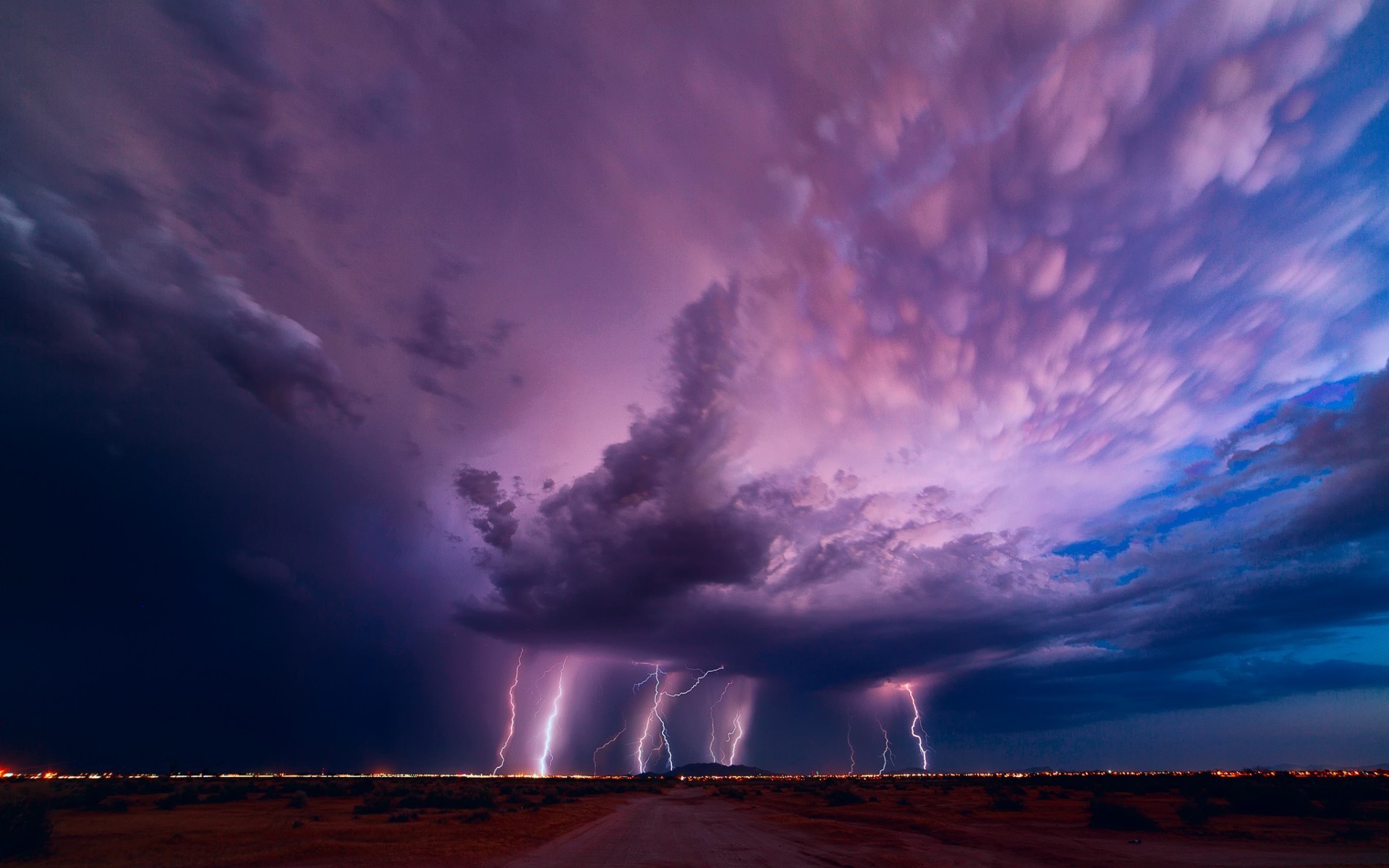 Purple lightning from a thunderstorm cloud Desktop wallpaper 1280x800
