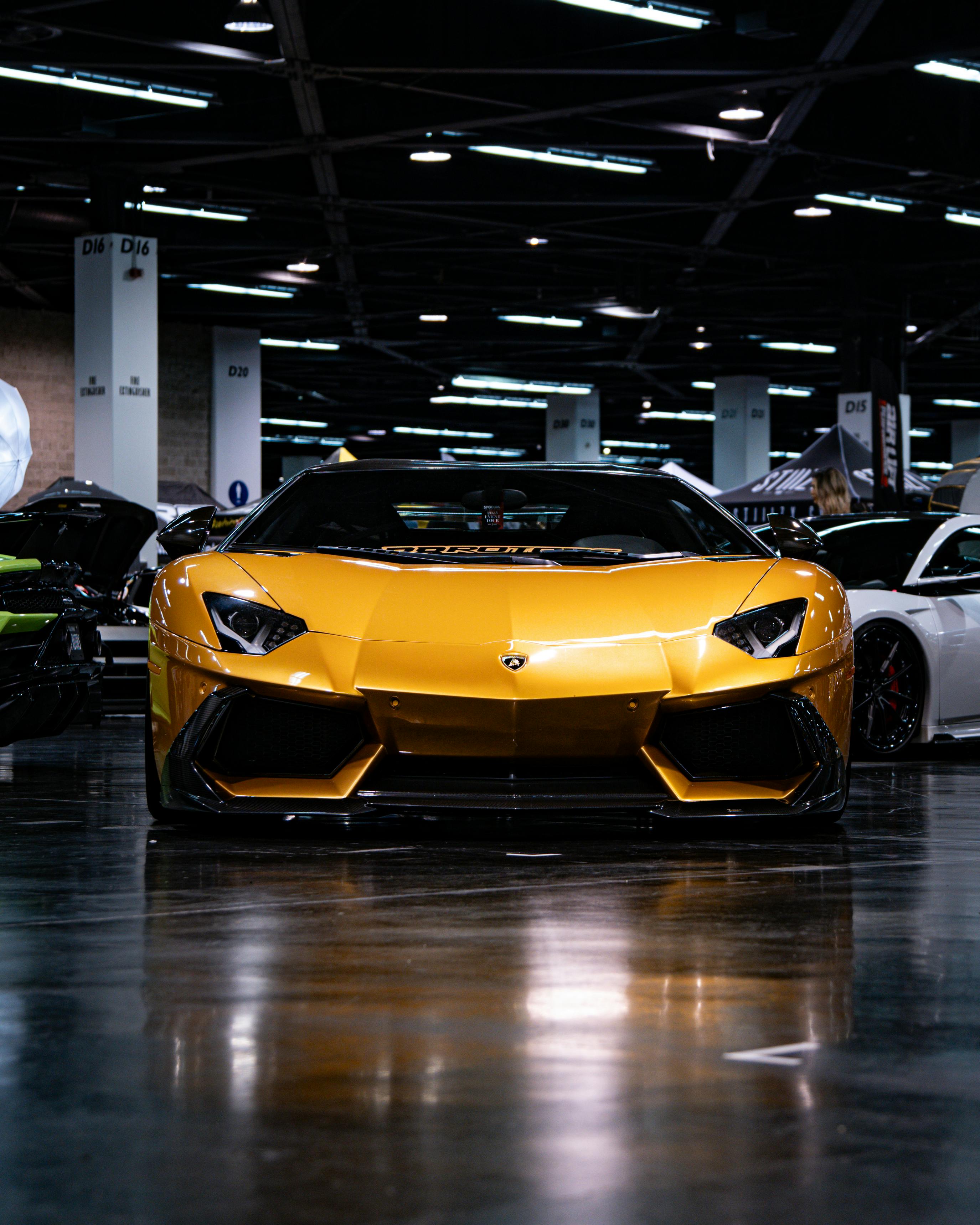 Yellow Lamborghini Revuelto Supercar in Showroom · Free