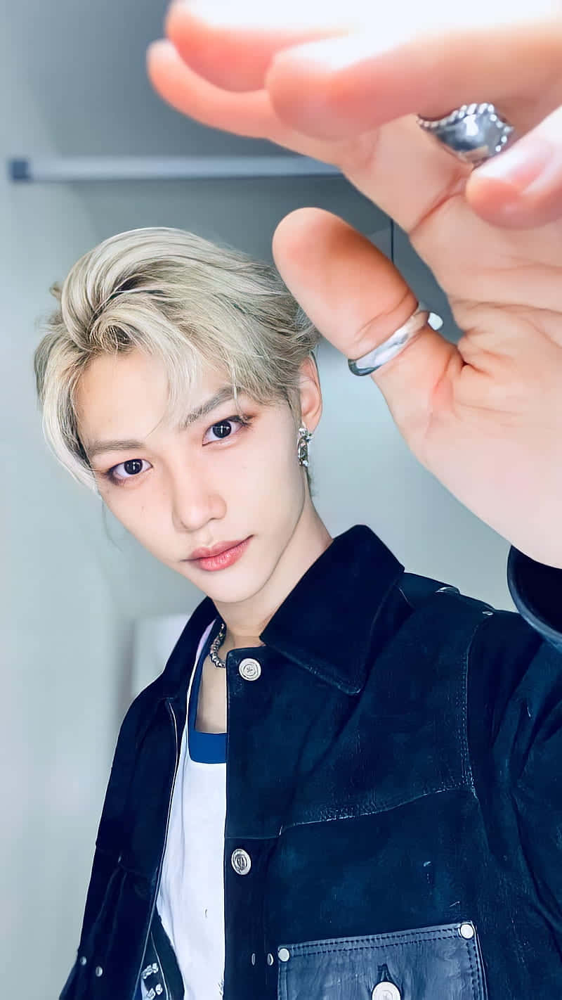 Download Pulling off some powerful moves, Felix of Stray Kids looks unstoppable. Wallpaper