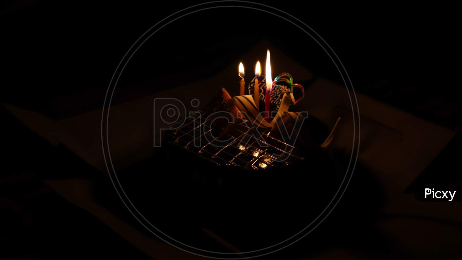 Image Of Birthday Cake Having Three Candels Lit Ina Dark Room VX301515 Picxy