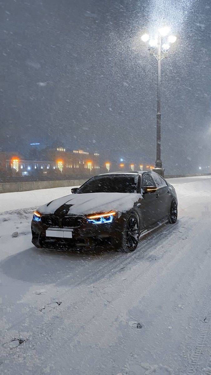 BMW Sports Car Parked in Snow