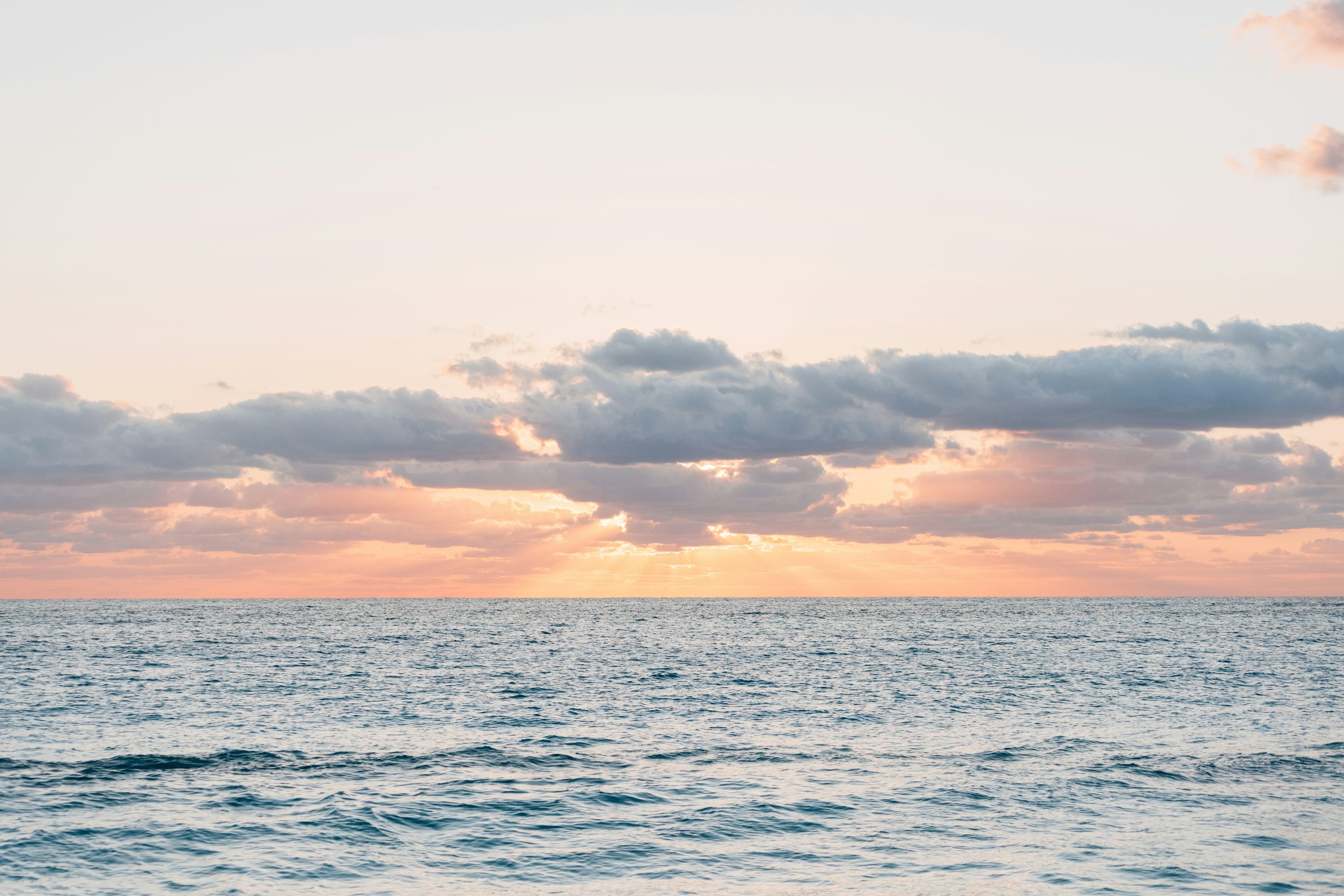 A peaceful sunset over the calming ocean. photo