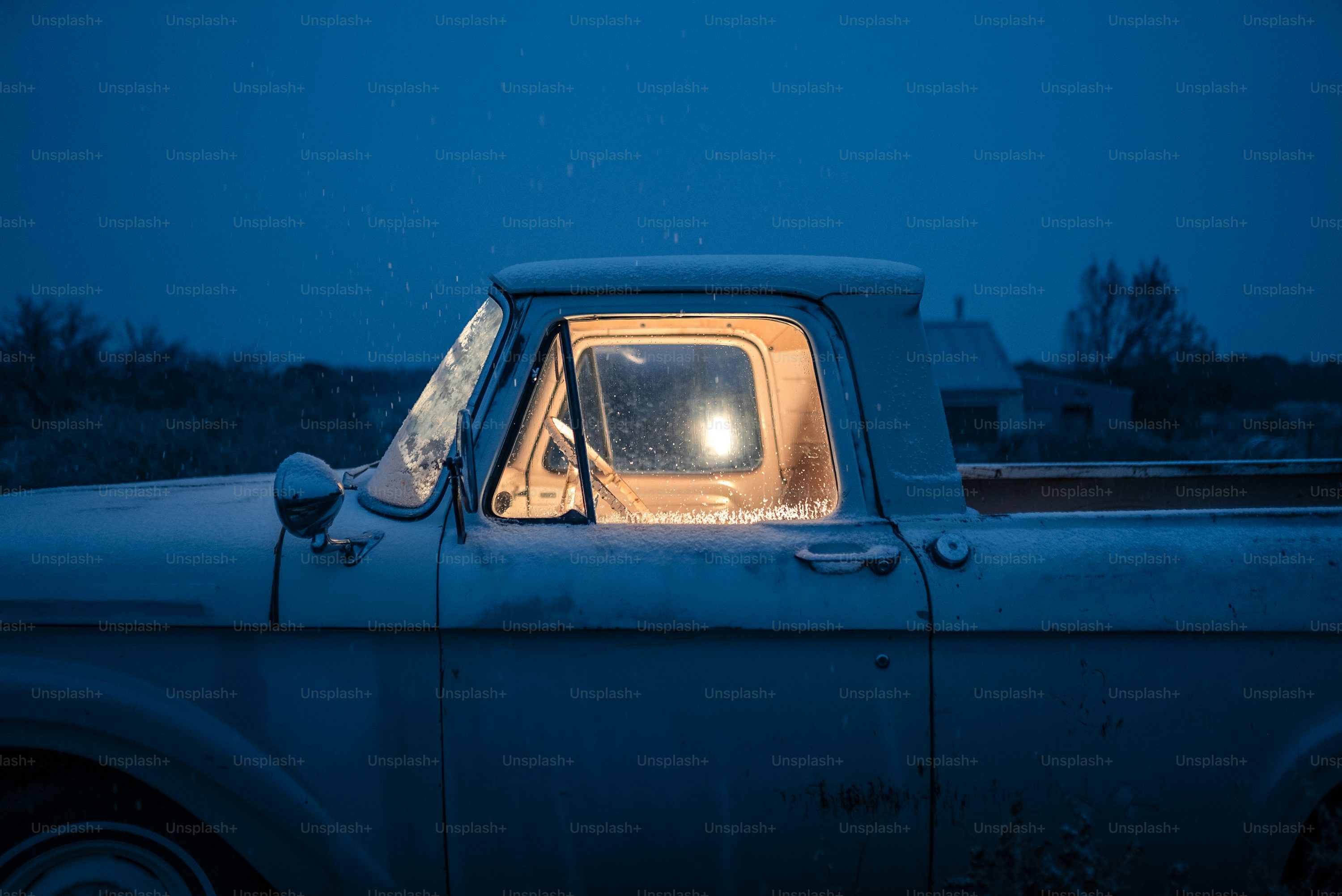An old truck with a light in the window photo