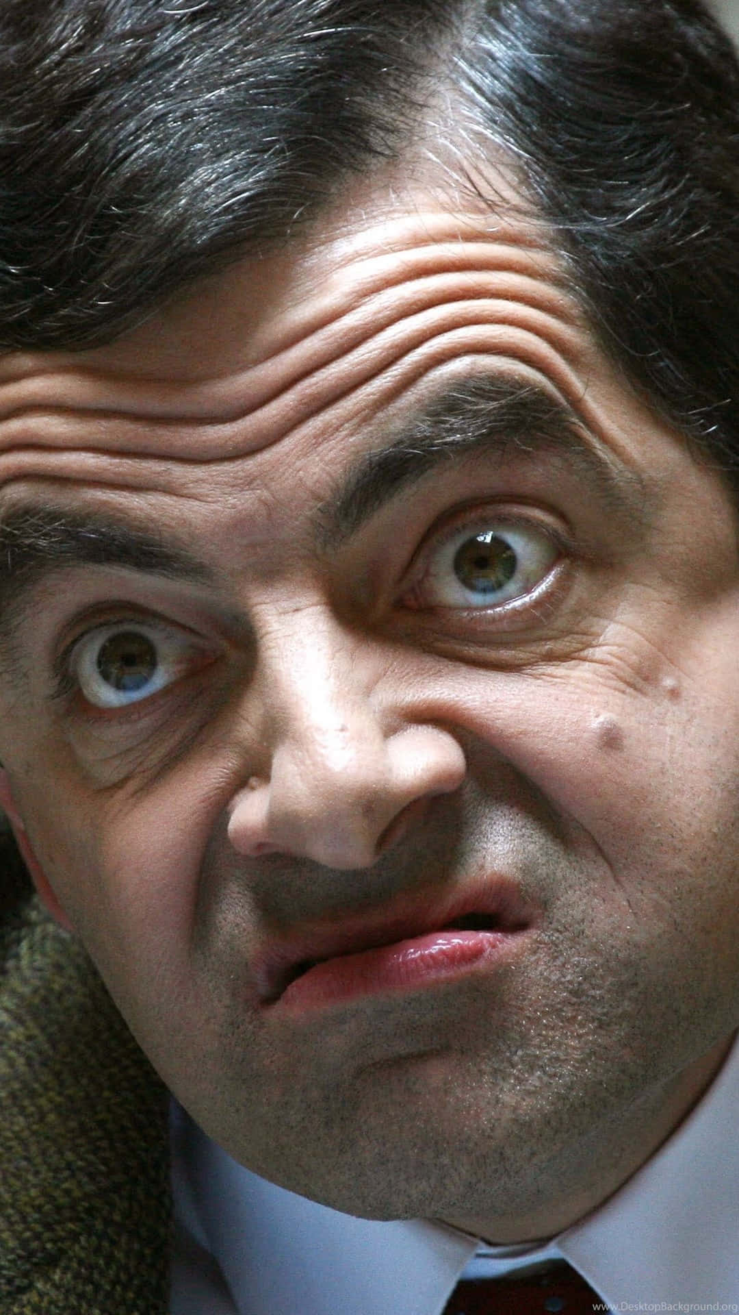 Download Mr. Bean in his Mini Cooper making a funny face