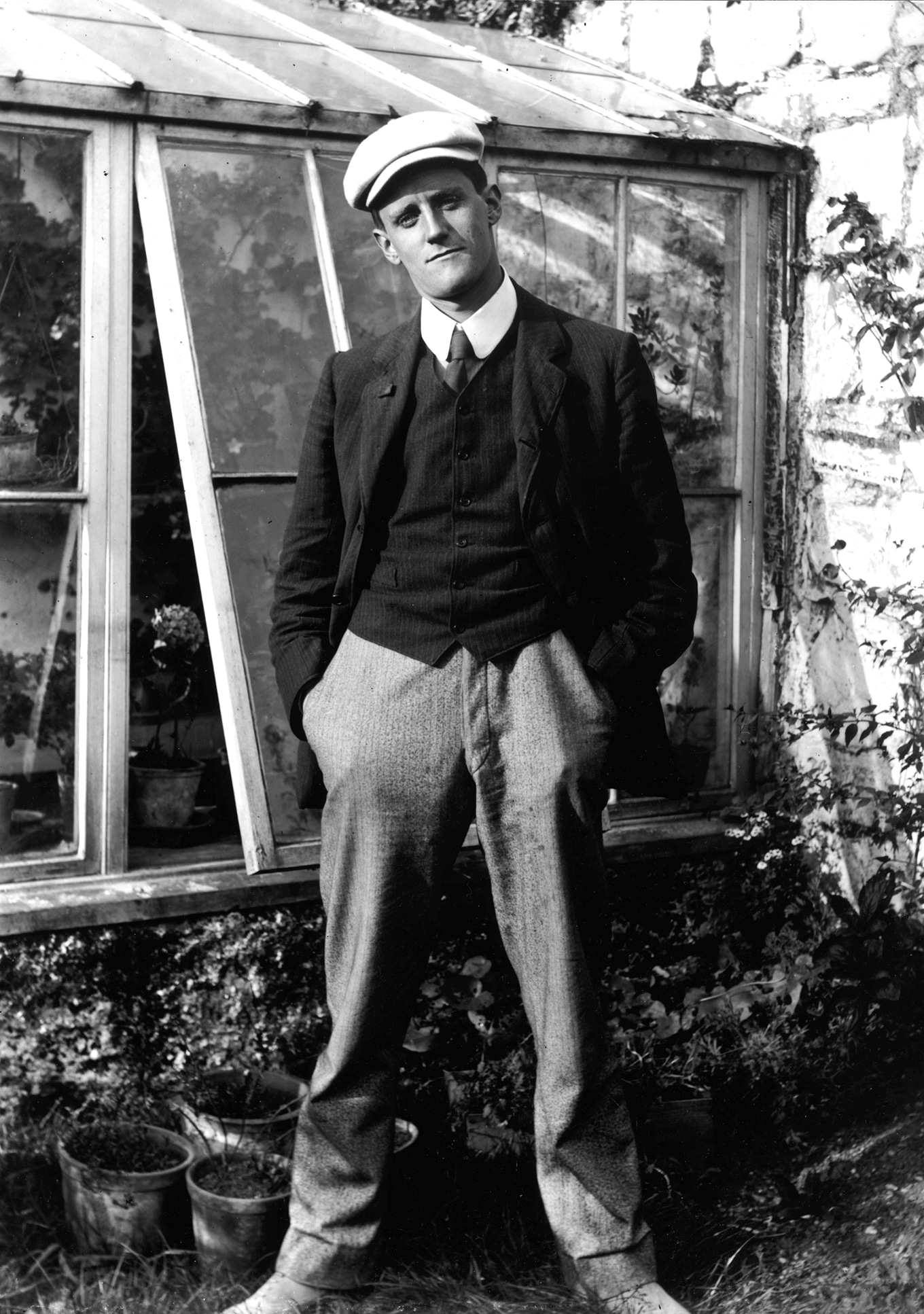 James Joyce Stands Beside a Greenhouse