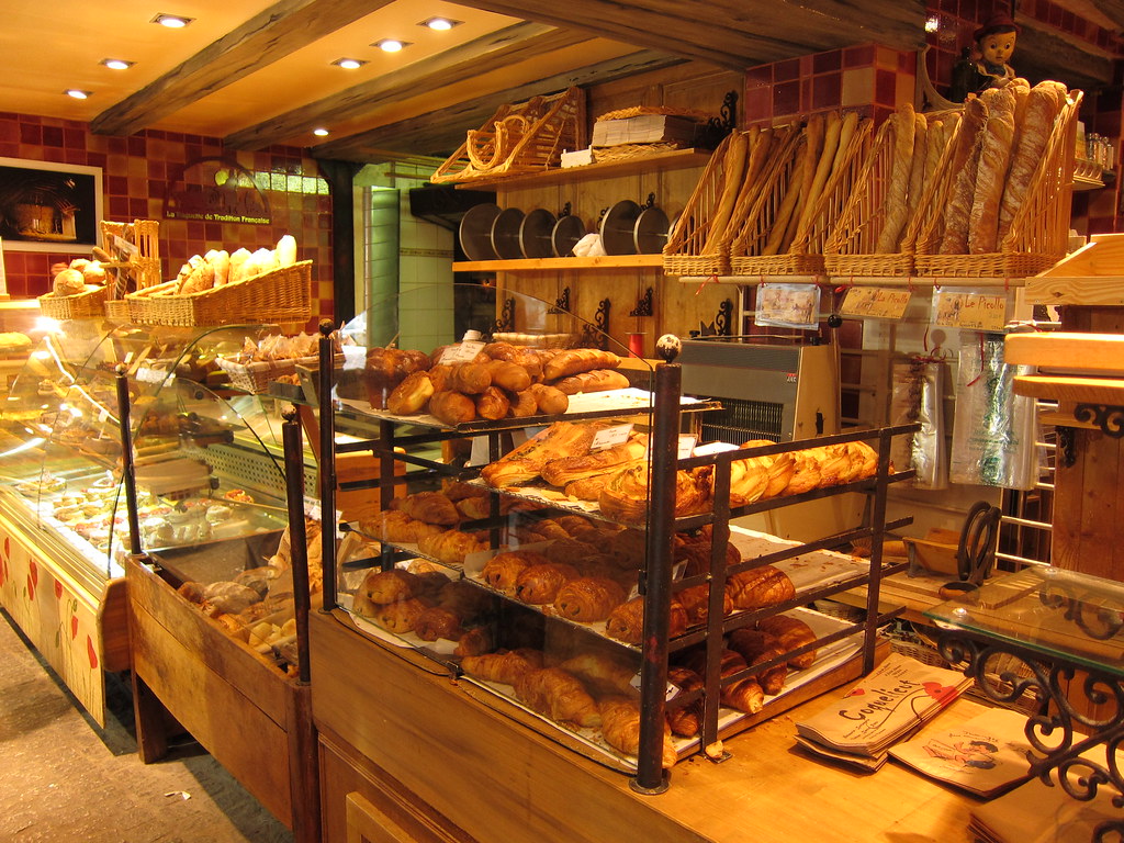 French Boulangerie. Warm and inviting with shelves lined wi