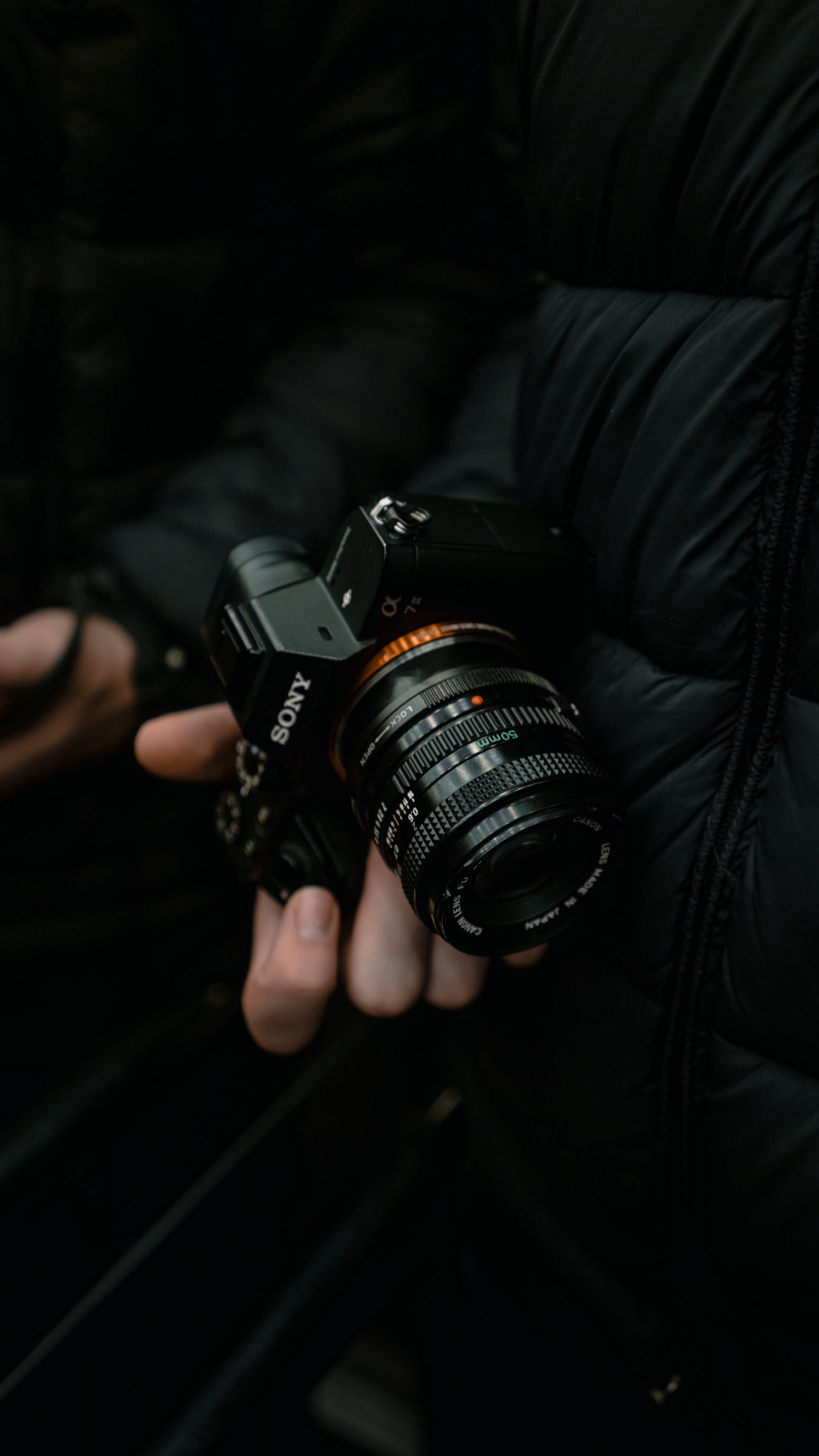 Download wallpaper 1350x2400 camera, black, photographer, hand iphone 8+/7+/6s+/for parallax HD background