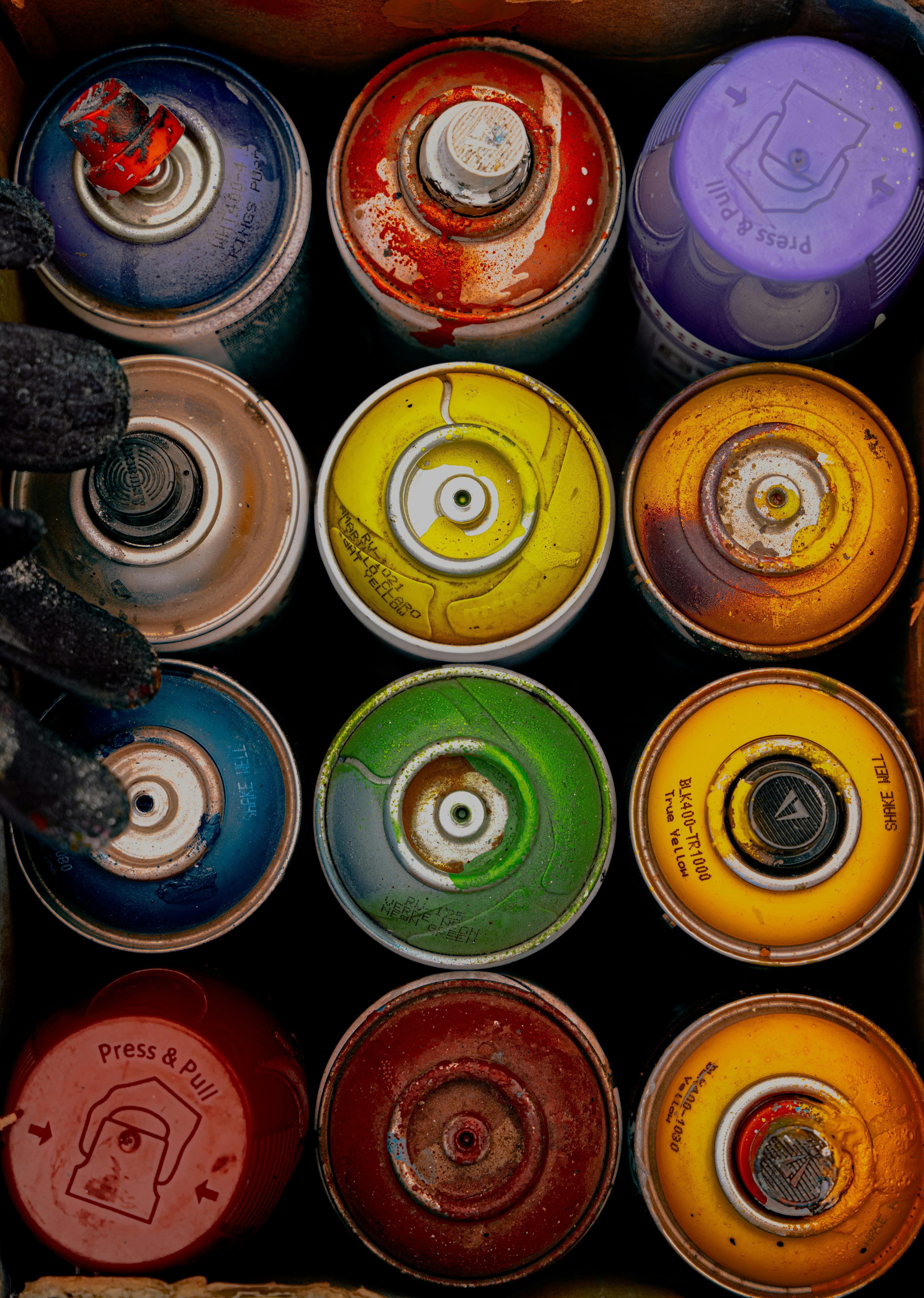 Colorful Spray Paint Cans Top View · Free