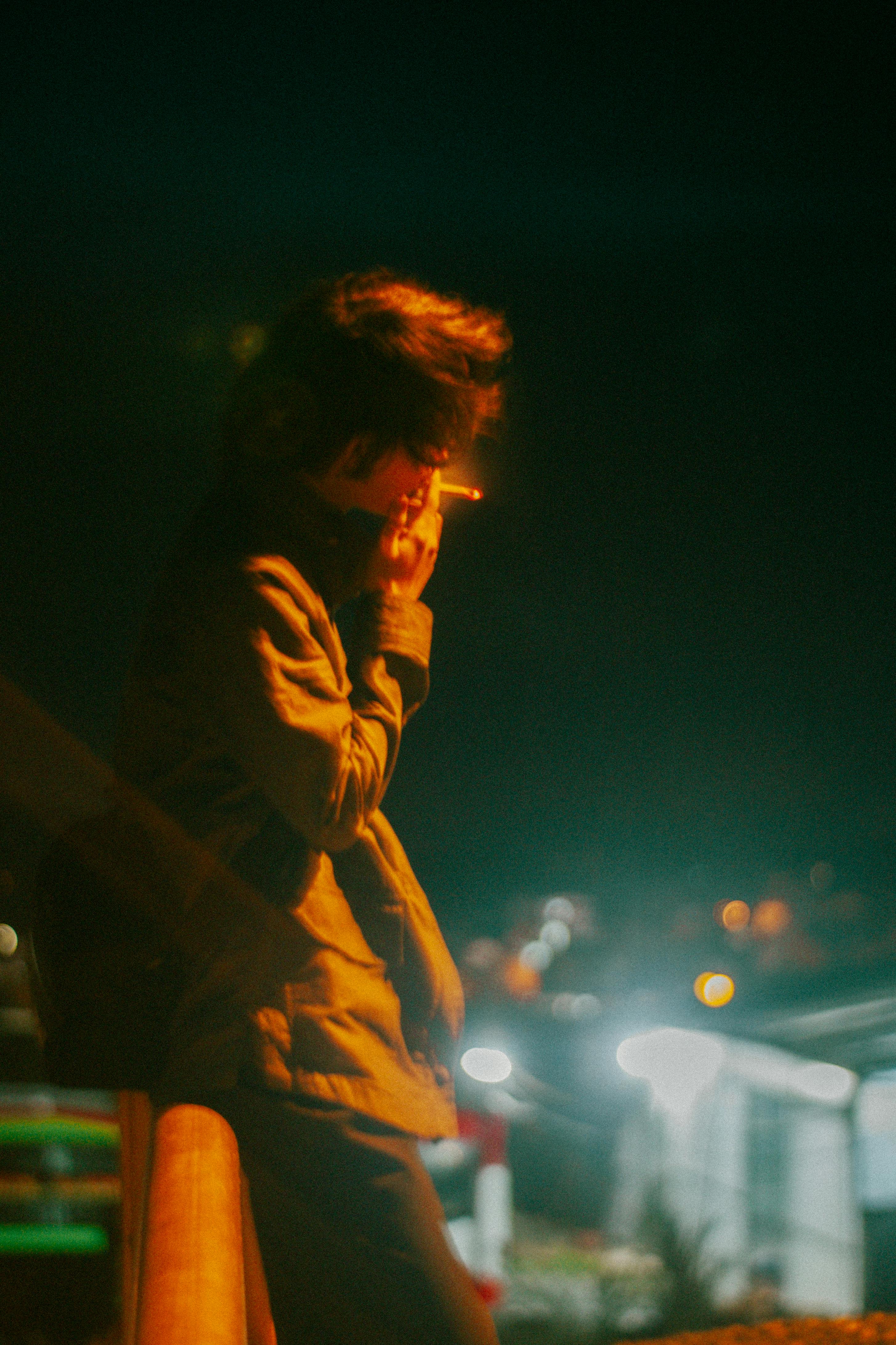 Woman Sitting and Smoking · Free