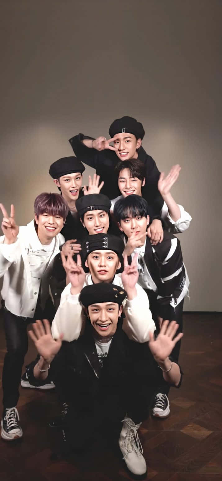 Download A Group Of Young Men Posing For A Photo Wallpaper