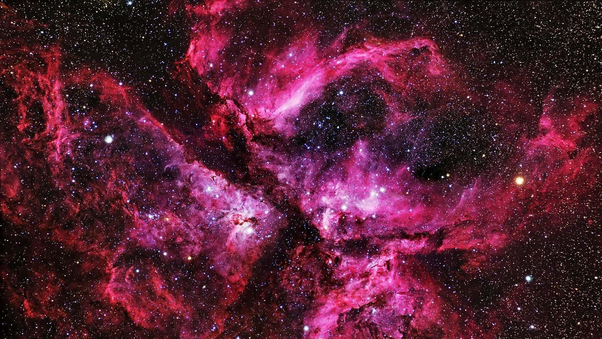 Download A Pink Nebula With Stars In The Background