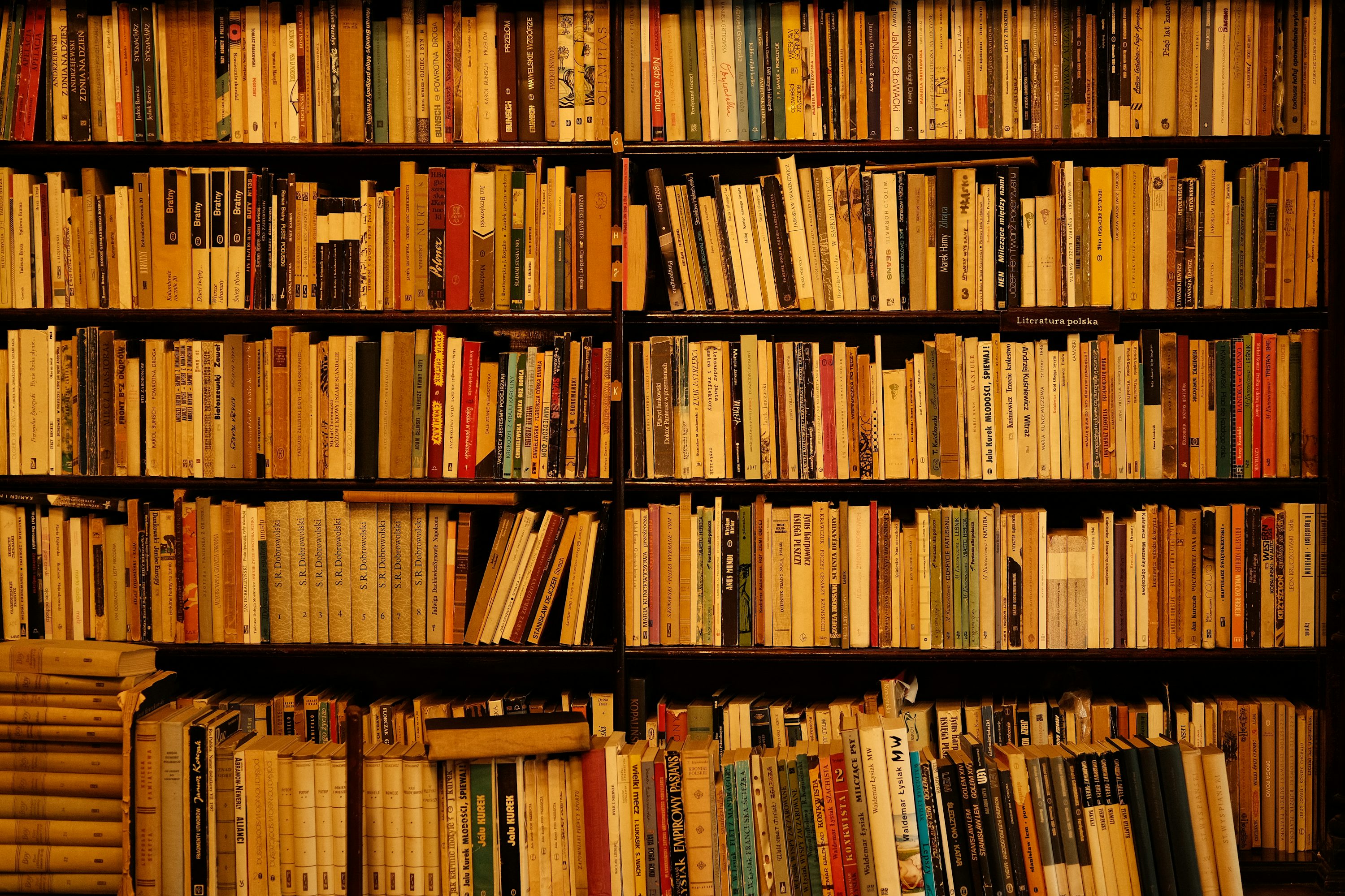 A book shelf filled with lots of books
