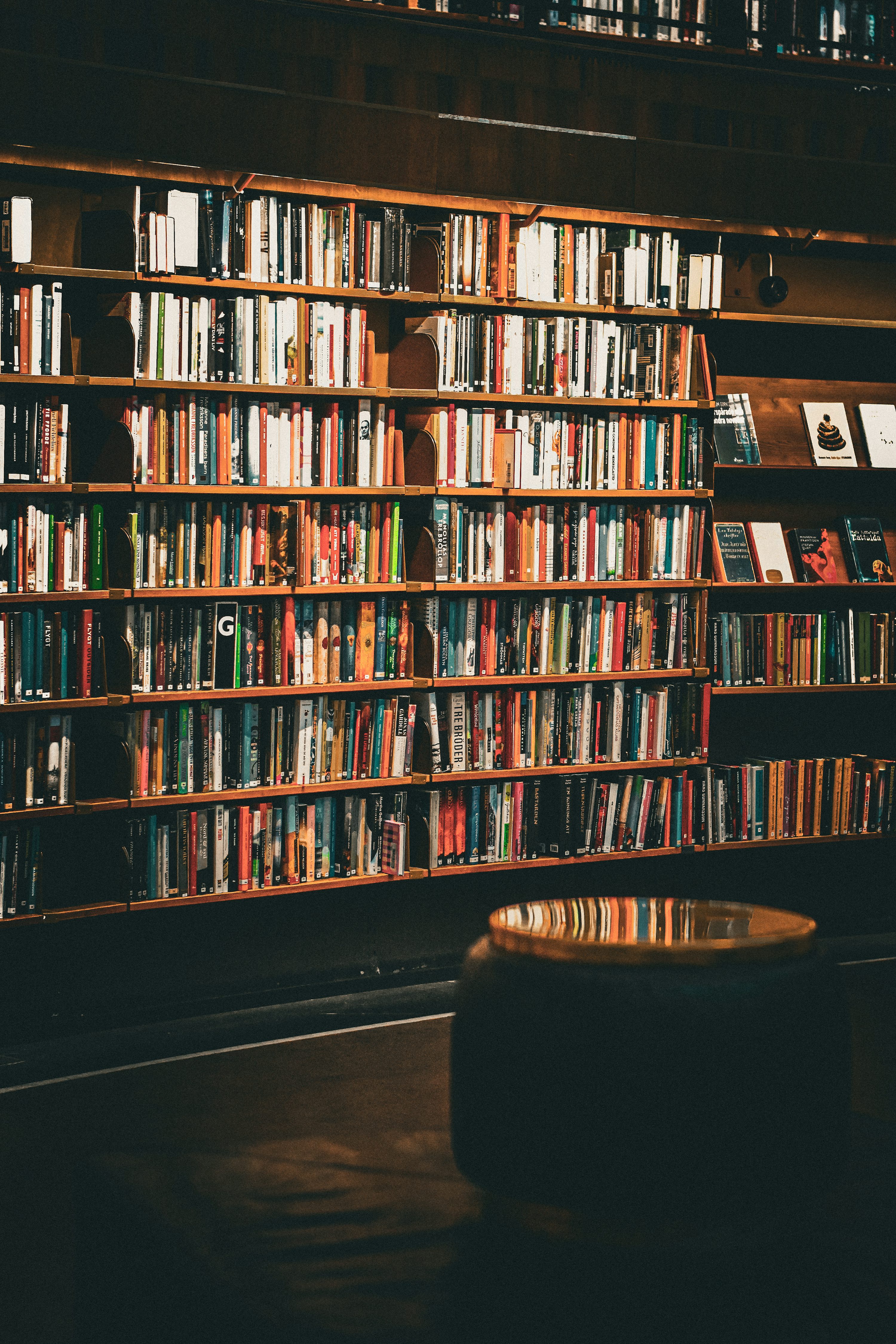 A bookshelf filled with lots of books