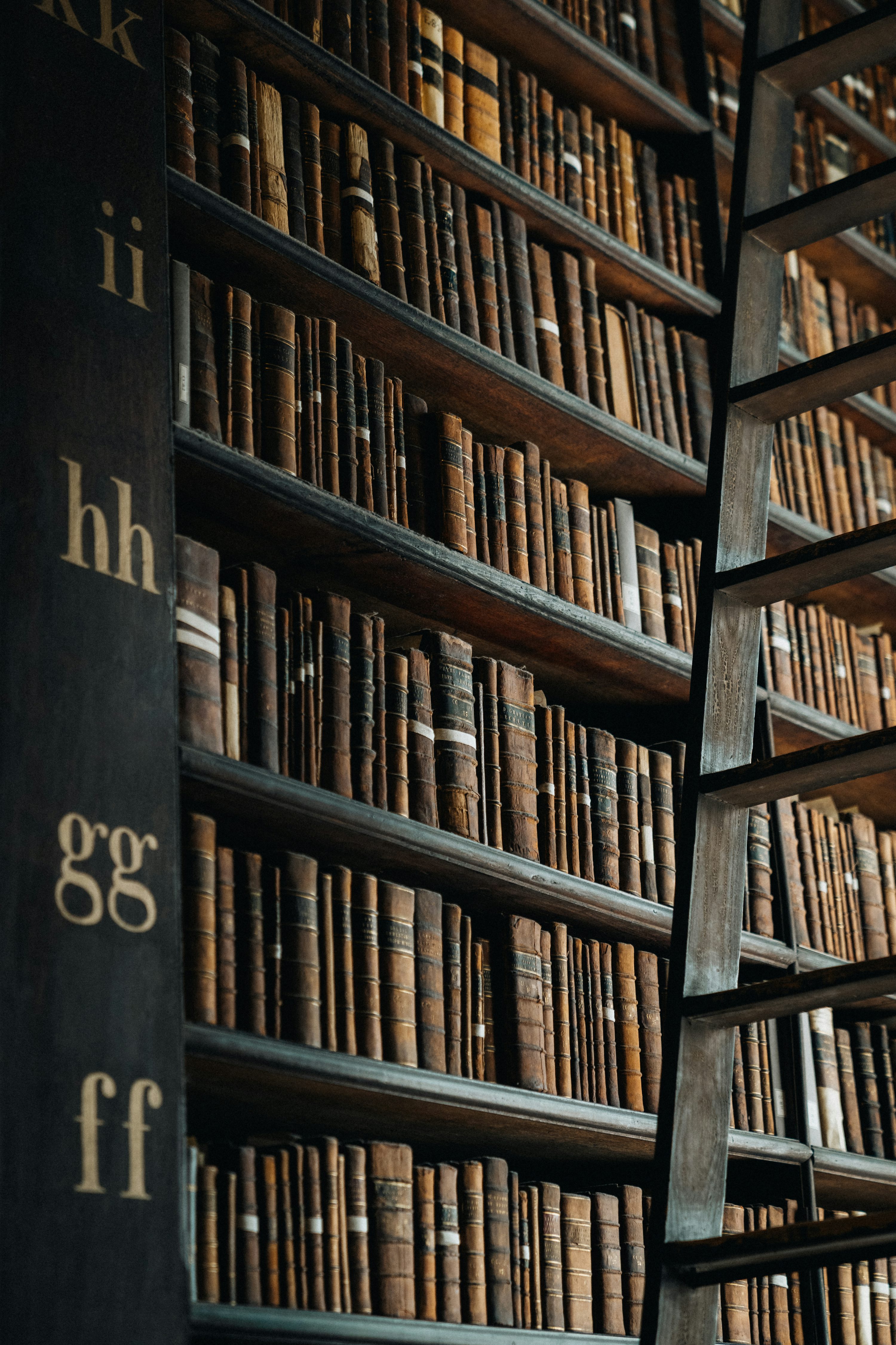A bookshelf filled with lots of books