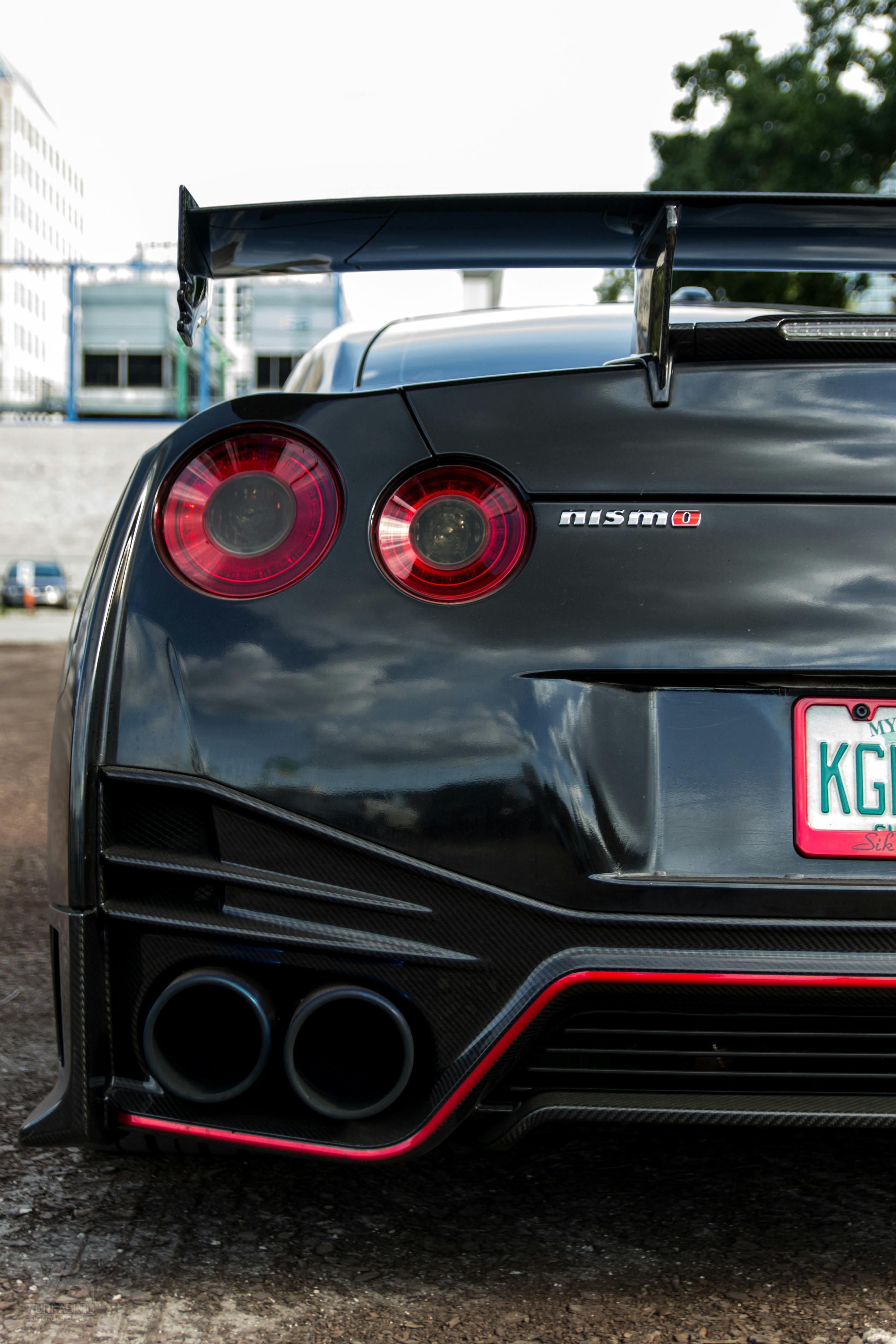 Close Up Photo of a Black Nissan Gtr Car · Free