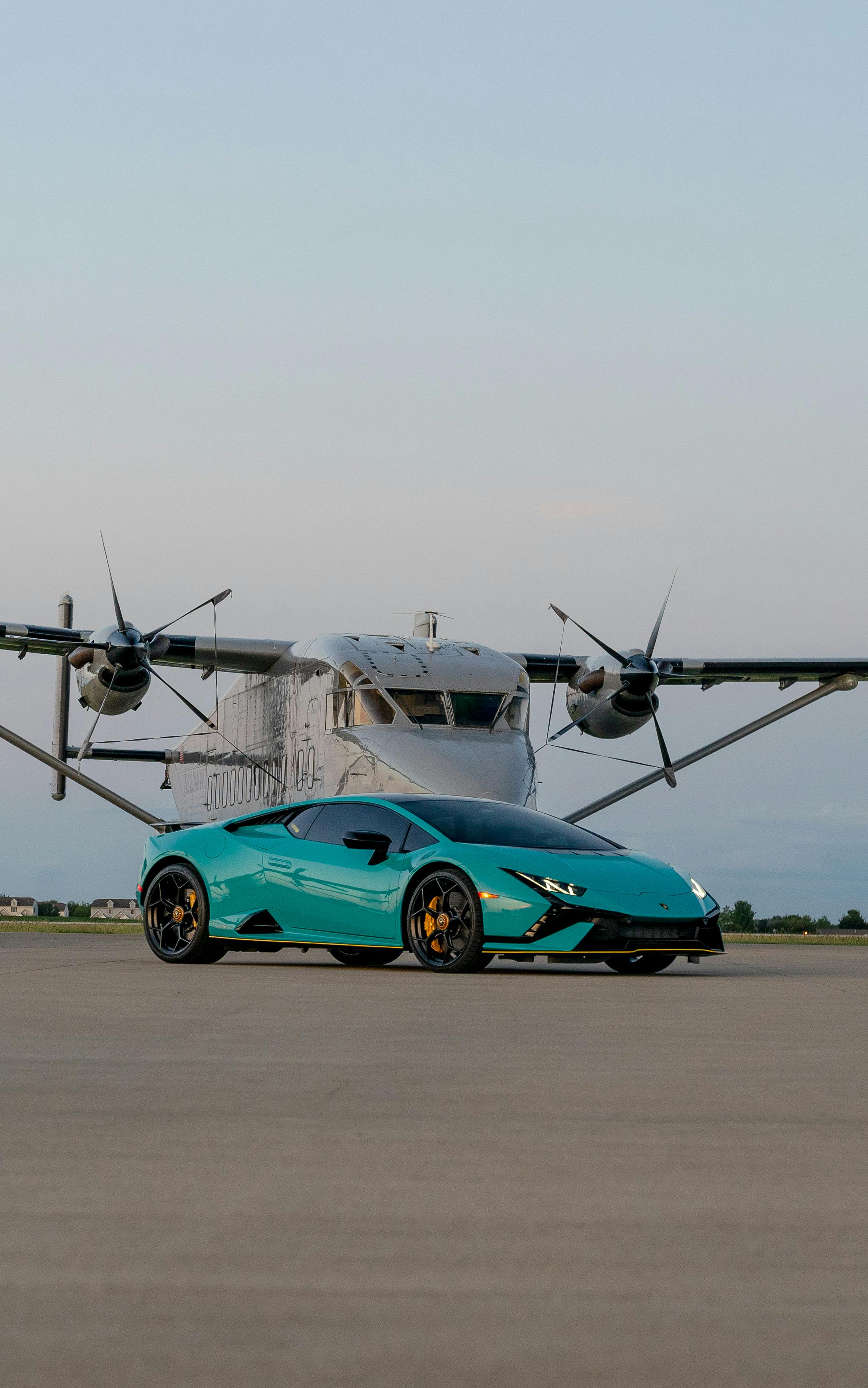 Luxury Sports Car with Private Plane Backdrop · Free