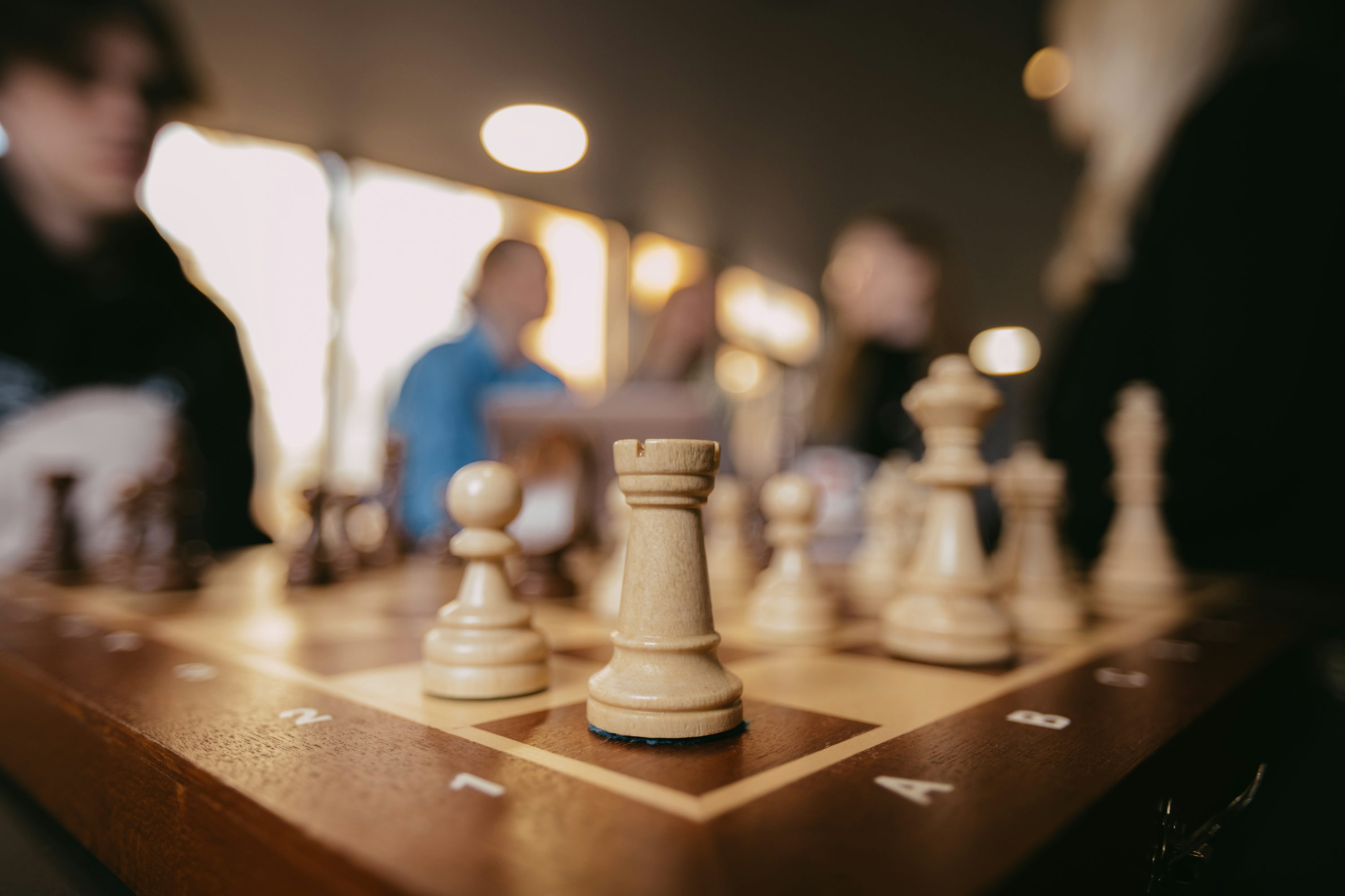 Chess game in progress, focused on a rook. photo