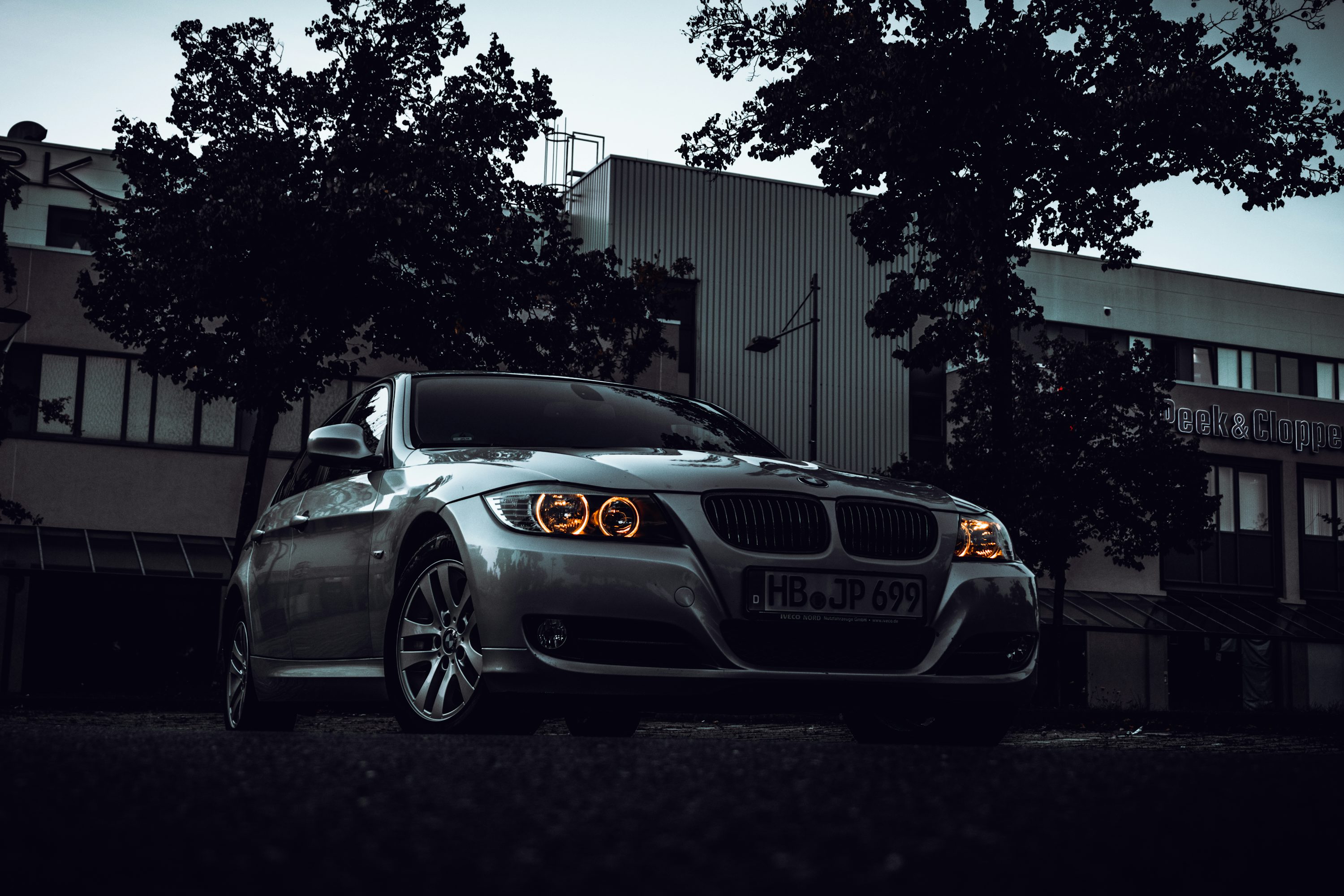 Gray bmw m 3 coupe parked near tree photo