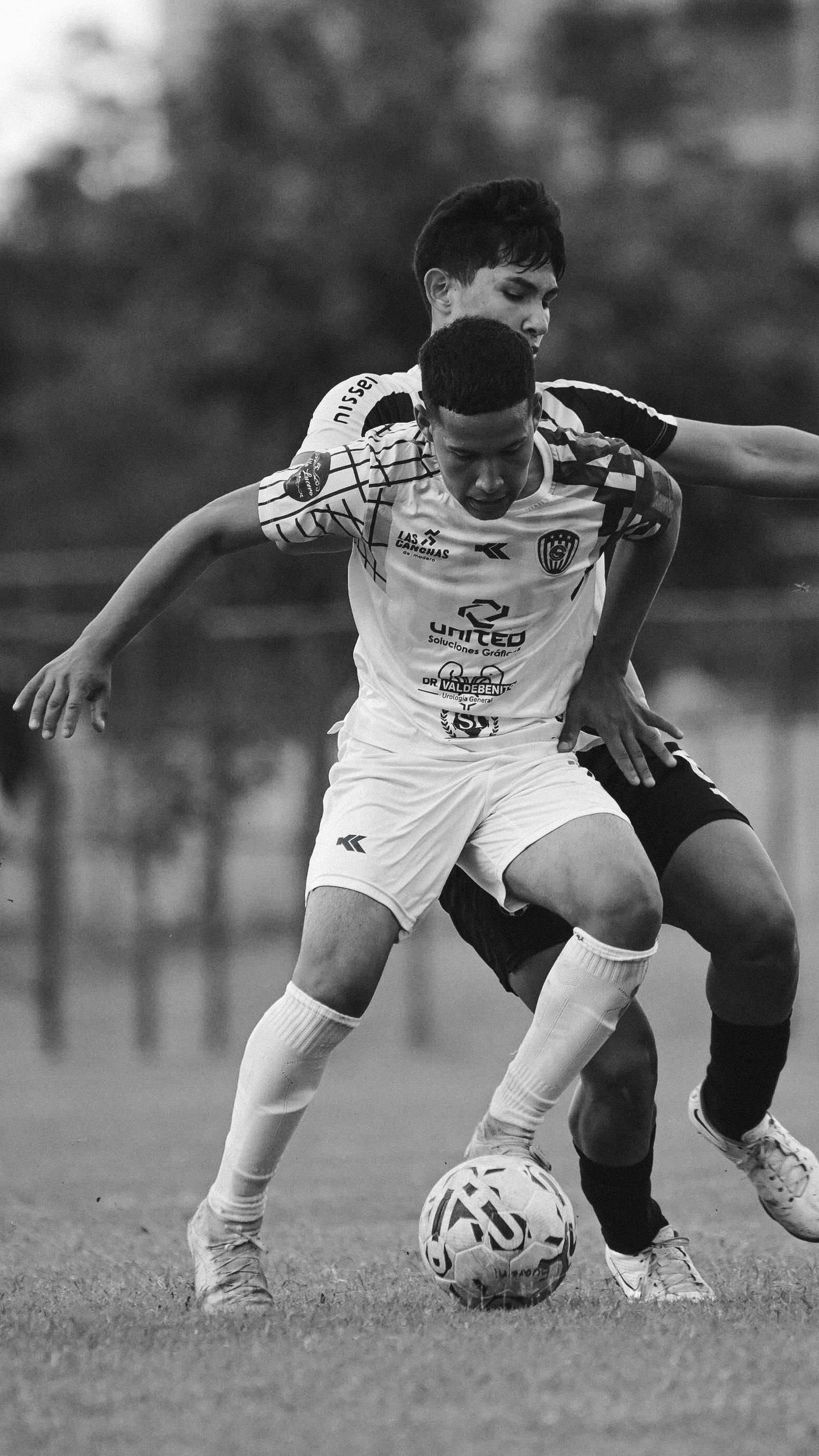 Men Playing Soccer in Black and White · Free