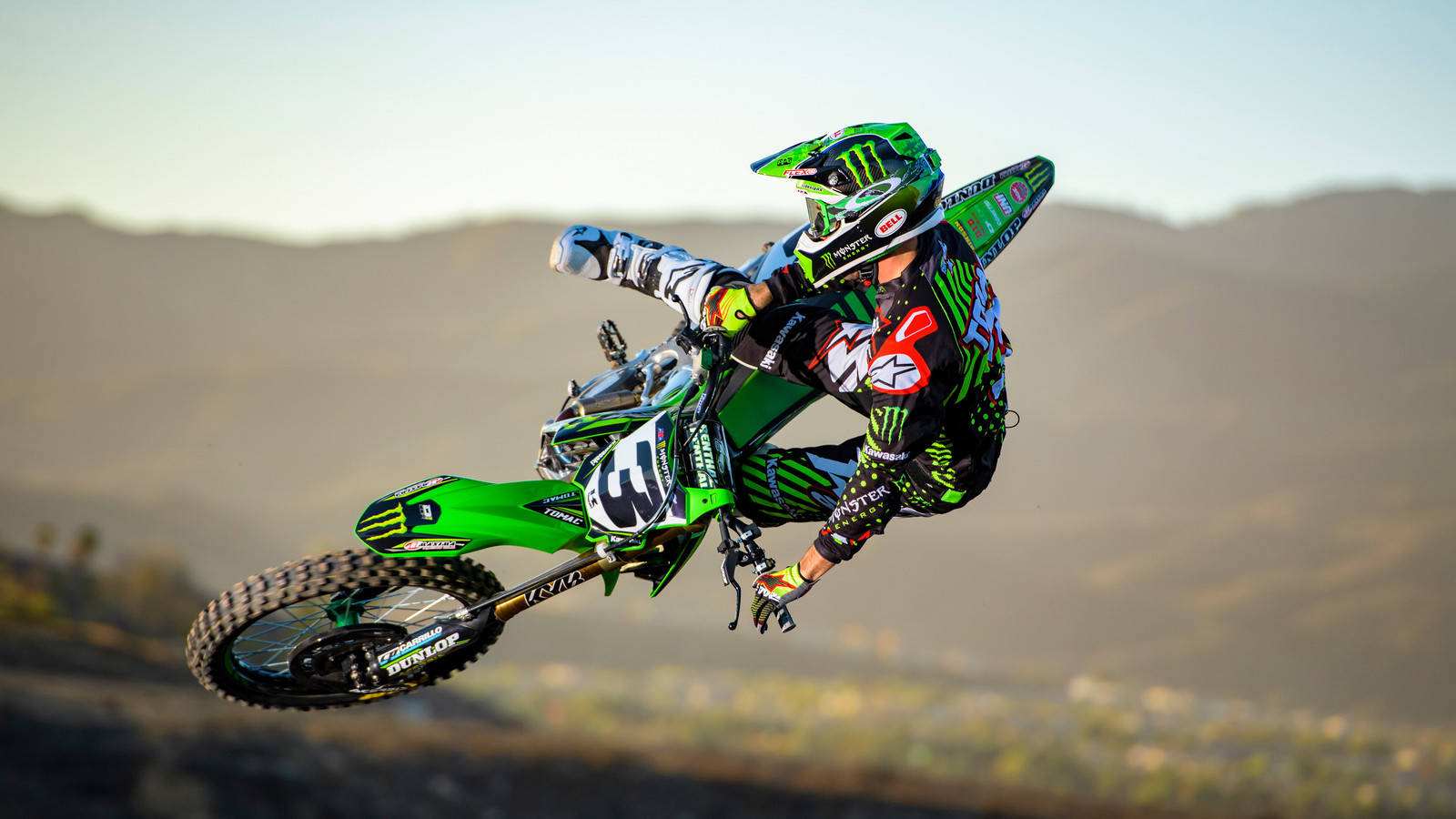 Download Thrilling Action with a Monster Dirt Bike Wallpaper