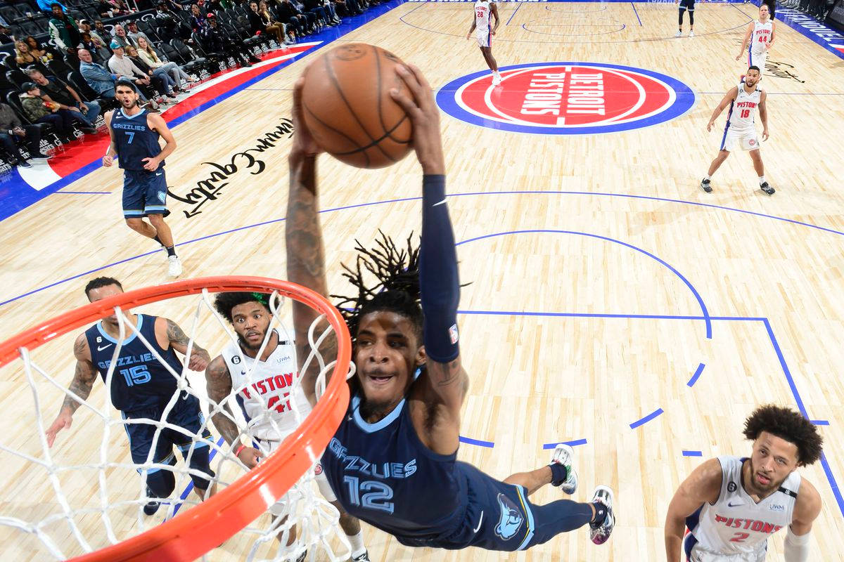 Download Ja Morant Dunk In Pistons Arena Wallpaper