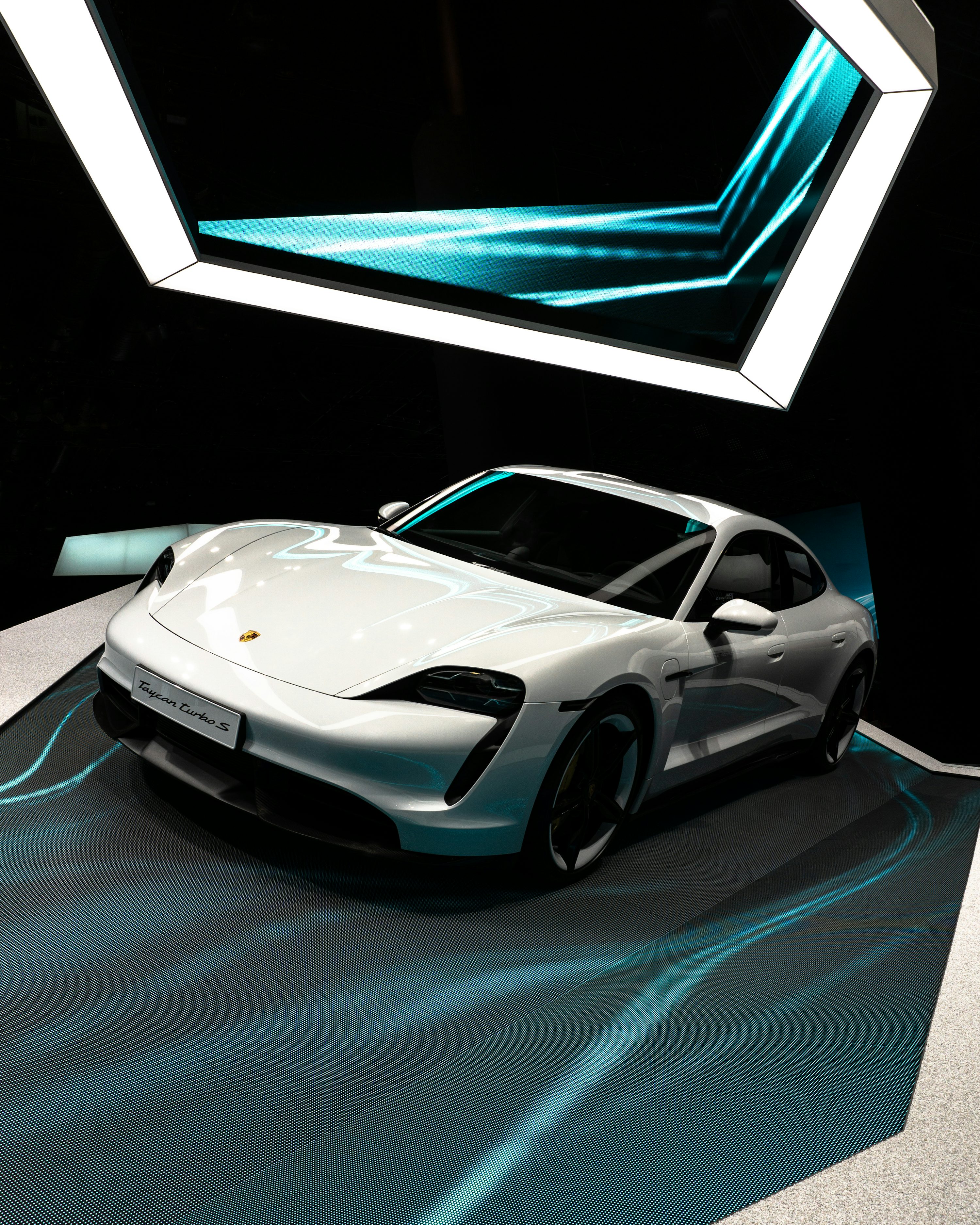 White sedan on black surface photo