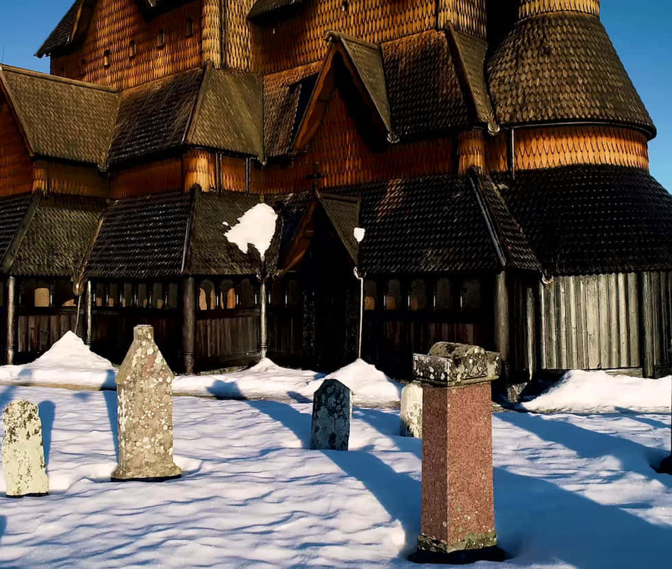 Download Heddal Stave Church Graveyard With Snow Wallpaper