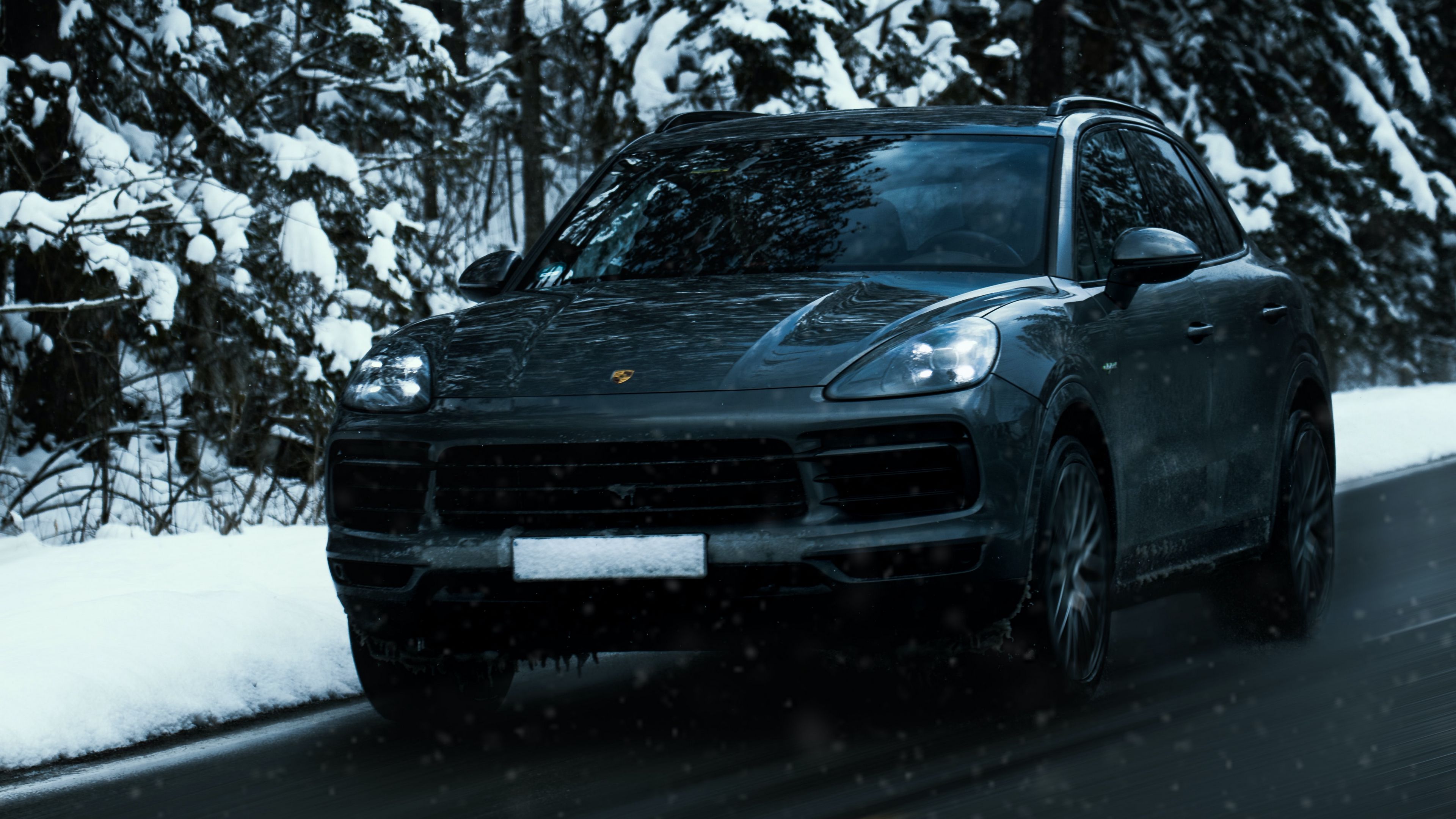 Download wallpaper 3840x2160 porsche cayenne, porsche, car, black, road, snow, winter 4k uhd 16:9 HD background