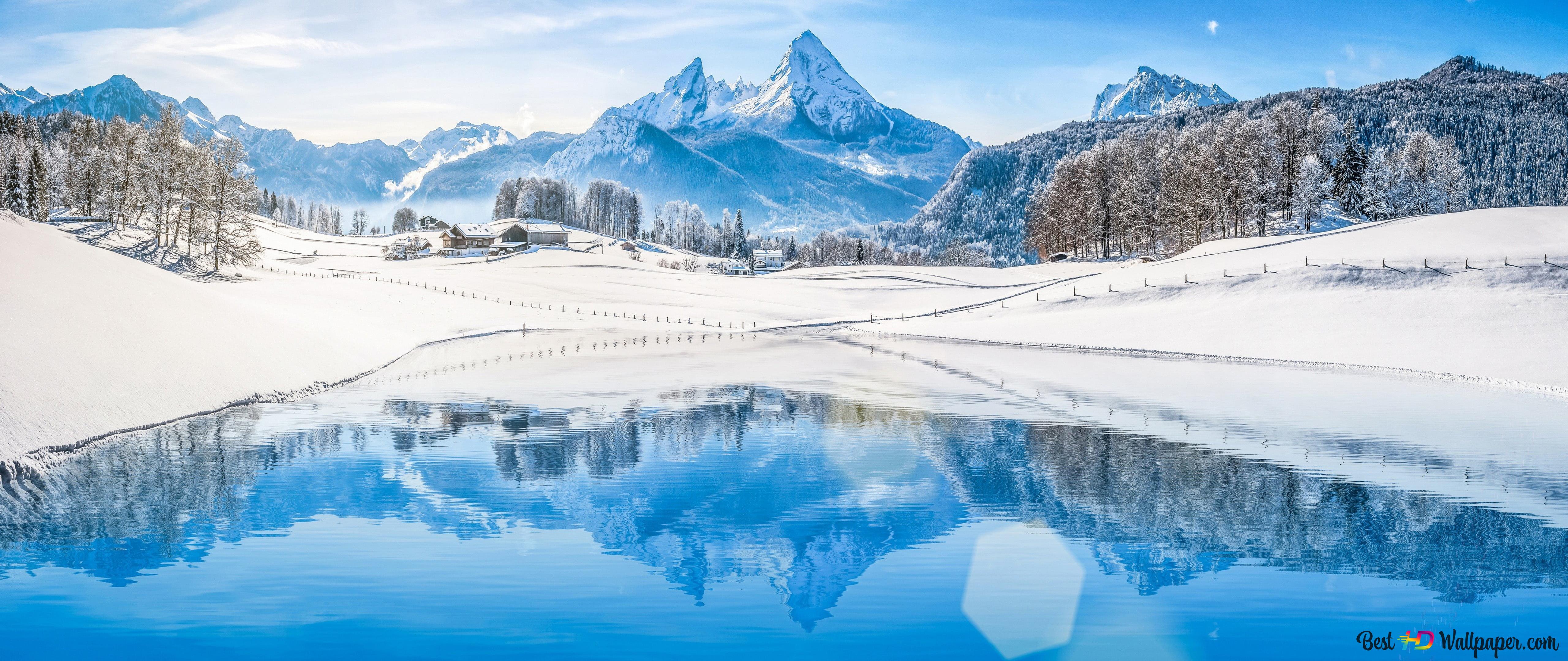 Snowy mountains and winter landscapes reflected in the lake 4K wallpaper download