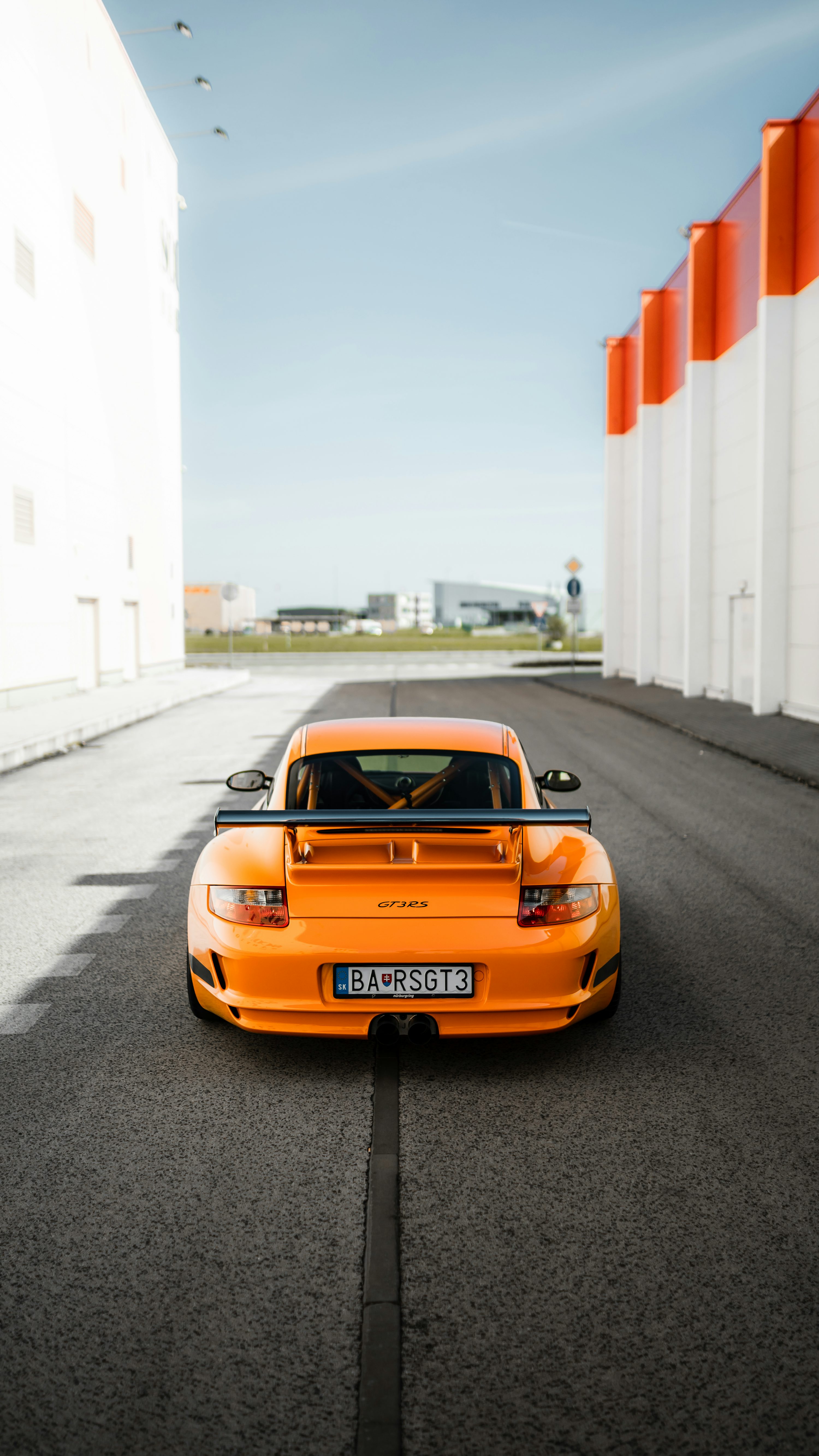 Orange porsche 911 on road during daytime photo