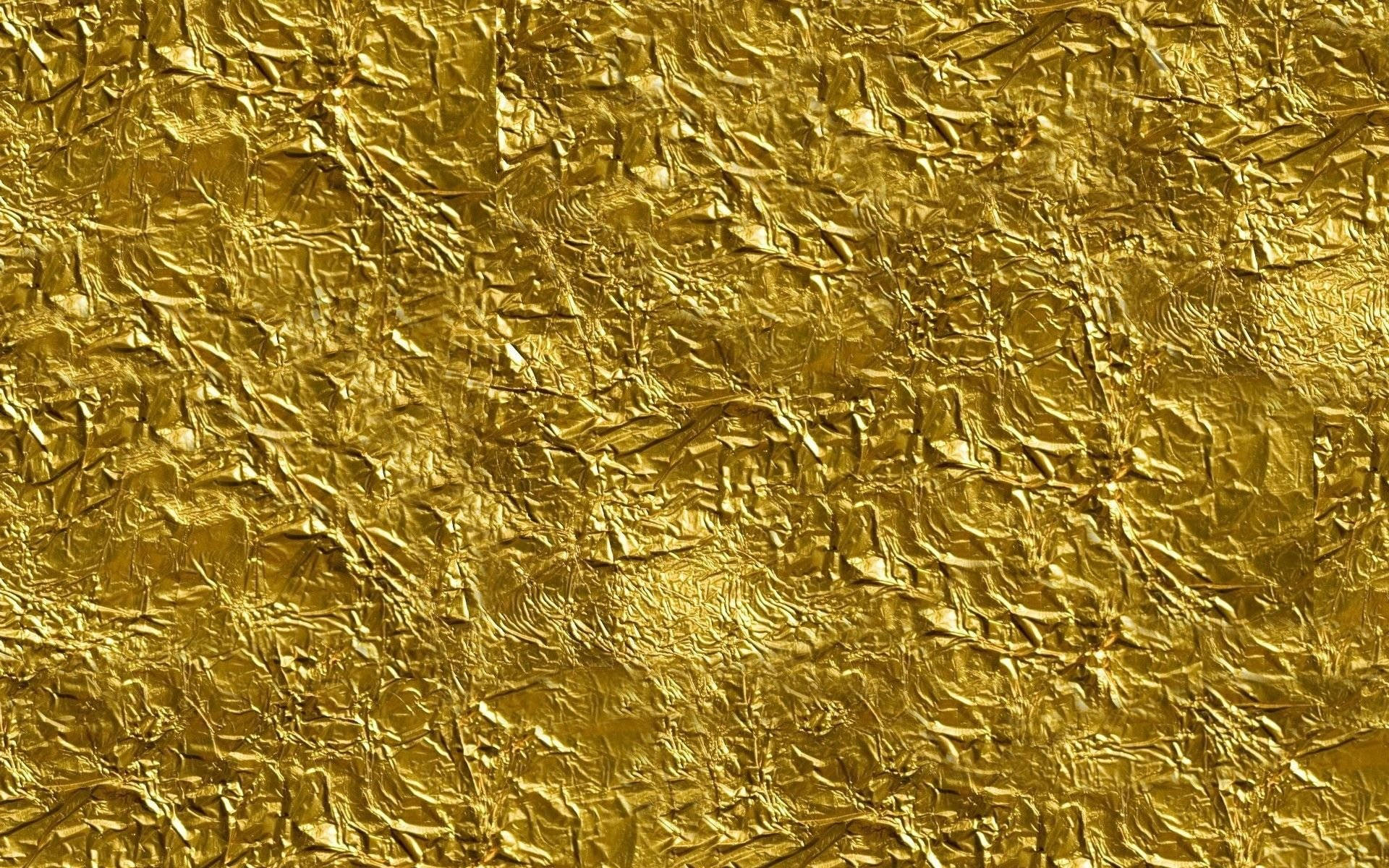 Download Vibrant Crushed Gold Foil Texture Wallpaper