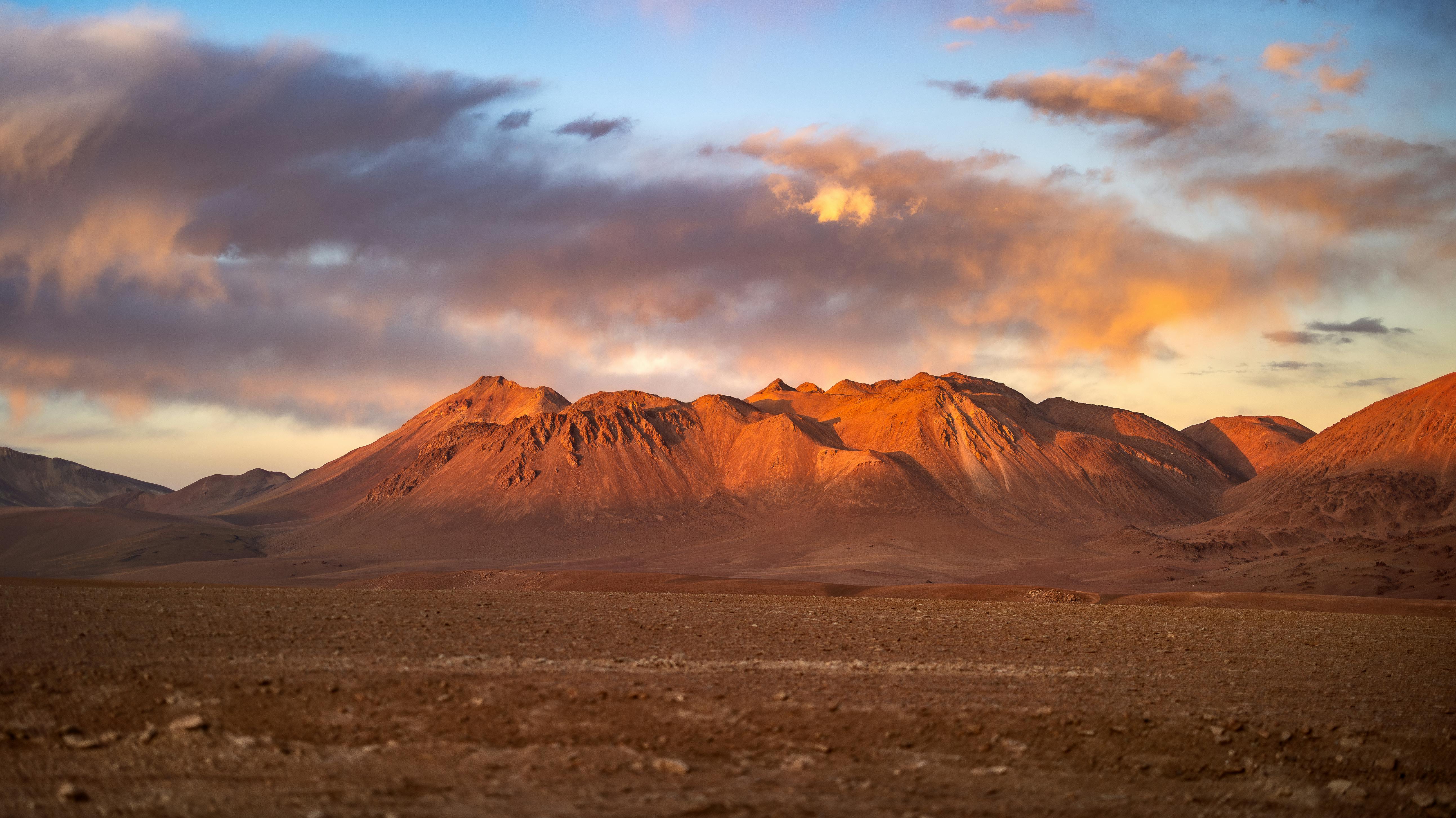 Barren Hills behind Desert at Sunset · Free
